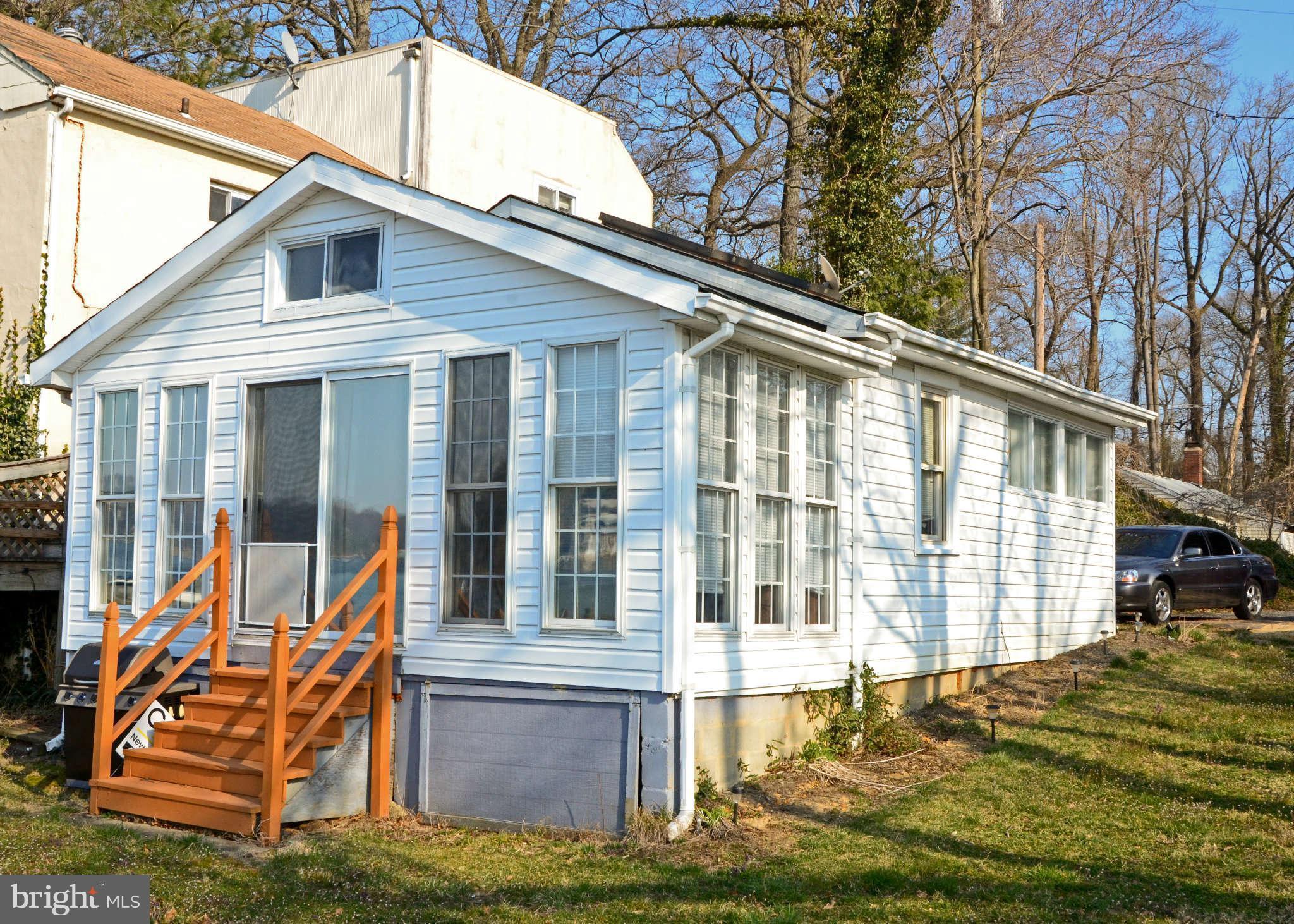 24 Hour Notice Required Call CSS for Showing Instructions. Do not pet cats or let them out of house..  Nice cottage sitting on Valentine Creek w/50'waterfront, great view, 65' pier w/average 6'water  depth end of pier. Dock with power/water,  new 2006 bulk head, vinyl sided 2008, updated bathroom 2008, expired building permits, sold strictly "AS IS".  Call CSS for showing