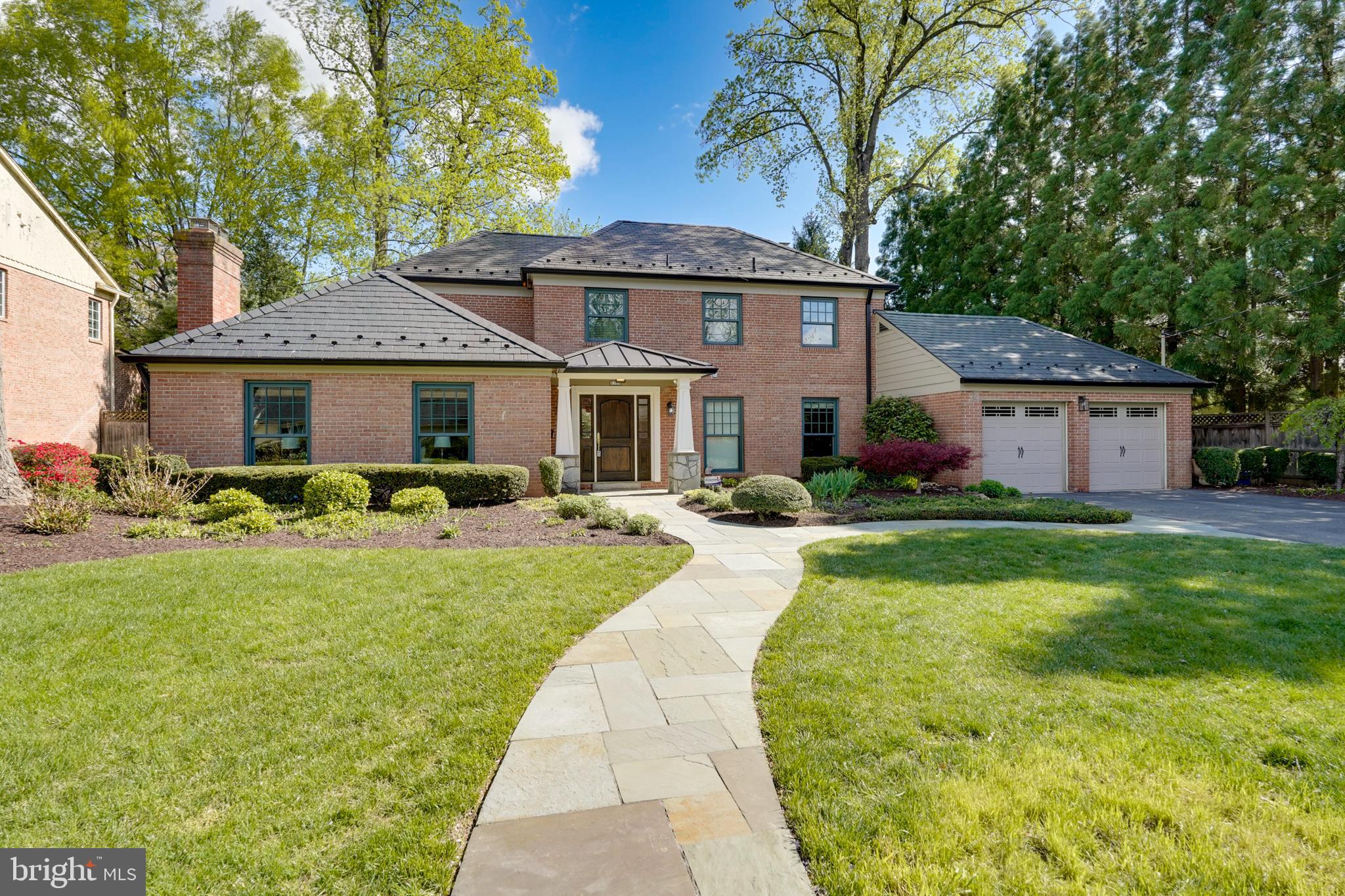 Grand and gracious, this beautifully updated brick Colonial in sought-after Kenwood Park offers over 5,100 square feet of finished living space on three levels, set on a beautifully landscaped and private quarter-acre lot. With a two-car garage, fully fenced backyard, and a gorgeous NEW slate roof, this home blends classic architecture with thoughtful modern updates throughout. With fresh paint and beautiful refinished hardwood floors, this home is ready for its next owners.  

The main level welcomes you with an elegant foyer, setting the tone for a refined and comfortable living experience. The formal living room with fireplace and formal dining room offer ideal spaces for entertaining, while the updated kitchen boasts a center island, stainless steel appliances, and a spacious breakfast area. A sun-filled family room with a fireplace, large private office with built-ins, and an expansive sunroom add flexibility and charm. A powder room and ample closet space complete the main level.

Upstairs, the primary suite features a walk-in closet and an en-suite bath with a double vanity and walk-in shower. A guest bedroom with private half bath, a bedroom with en-suite full bath, and two additional bedrooms share a remodeled hall bath, offering space and comfort for everyone.

The finished lower level includes a large recreation room with bar, a spacious bedroom, full hall bath, bonus flex room (perfect for a gym or second office), a laundry room, and ample storage.

Additional highlights include all new high-quality windows, a new slate roof, extensive landscaping, and a walk-up attic with exceptional storage and future expansion potential.

Ideally located in the heart of Kenwood Park, this home offers a rare combination of space, updates, and timeless appeal—all within minutes of downtown Bethesda, parks, top-rated schools, and commuter routes.