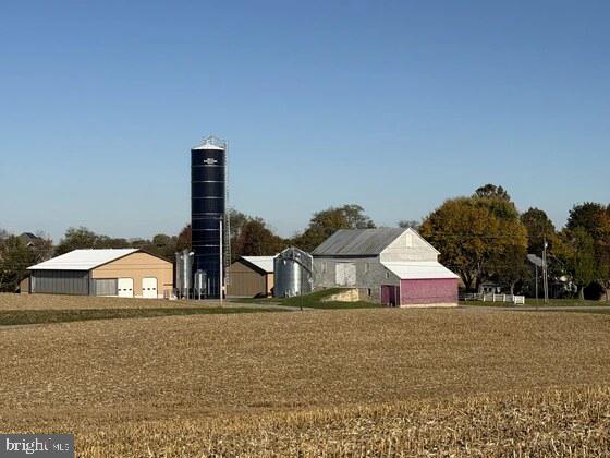 REAL ESTATE PUBLIC AUCTION, Saturday, March 14th 2026 @ 1:00 P.M .
40.3 Acre Farm; Buildings situated on a small Knoll with Spectacular Views of the South mountain & surrounding areas; 2 Story Brick home, 2,246 sq. ft. of living space; kitchen, dining room, living room, 3- bedrooms, 2 ½ baths; oil, hot water heat; 2- Fireplaces; Central Air; Woodstove in basement; 18’x36’ In Ground Pool; 42’x55’ Bank Barn w/ 42’x15’ wagon shed on one end & 12’x33’ Lean-To on the other end; 20’x90’ Silo built by Penn Jersey in 2020 w/ a completely rebuild Goliath unloader; Silo is full of Corn silage; other out buildings, 2- Pole Barn Type’s built on poured walled foundations; Building 1: Farm/Shop & Machinery Storage, 50’x80’ w/ 16ft. ceilings, shop portion is 30’x50’, well insulated, Epoxy coated floor, shop is plumbed for small bathroom, not built; Machinery side has 2- 20’x14’ garage type doors w/ electric openers; Building 2: Steer Barn, brand new 61’x87’ structure, 17’ ceilings w/ R23 Insulation above; Computer controlled adjustable curtains, Two 18’ 3 phase, variable speed fans; 44’ concrete bunk w/ taper board feeder; 15’x61’ covered manure storage on far end of building; LB FCC 12 Cattle chute w/ scales; 20’x20’ feed room w/ Reel mixer, 6 ton bins w/ Flex Augers into 5hp. grain processor; 6,000 BU Brock grain bin