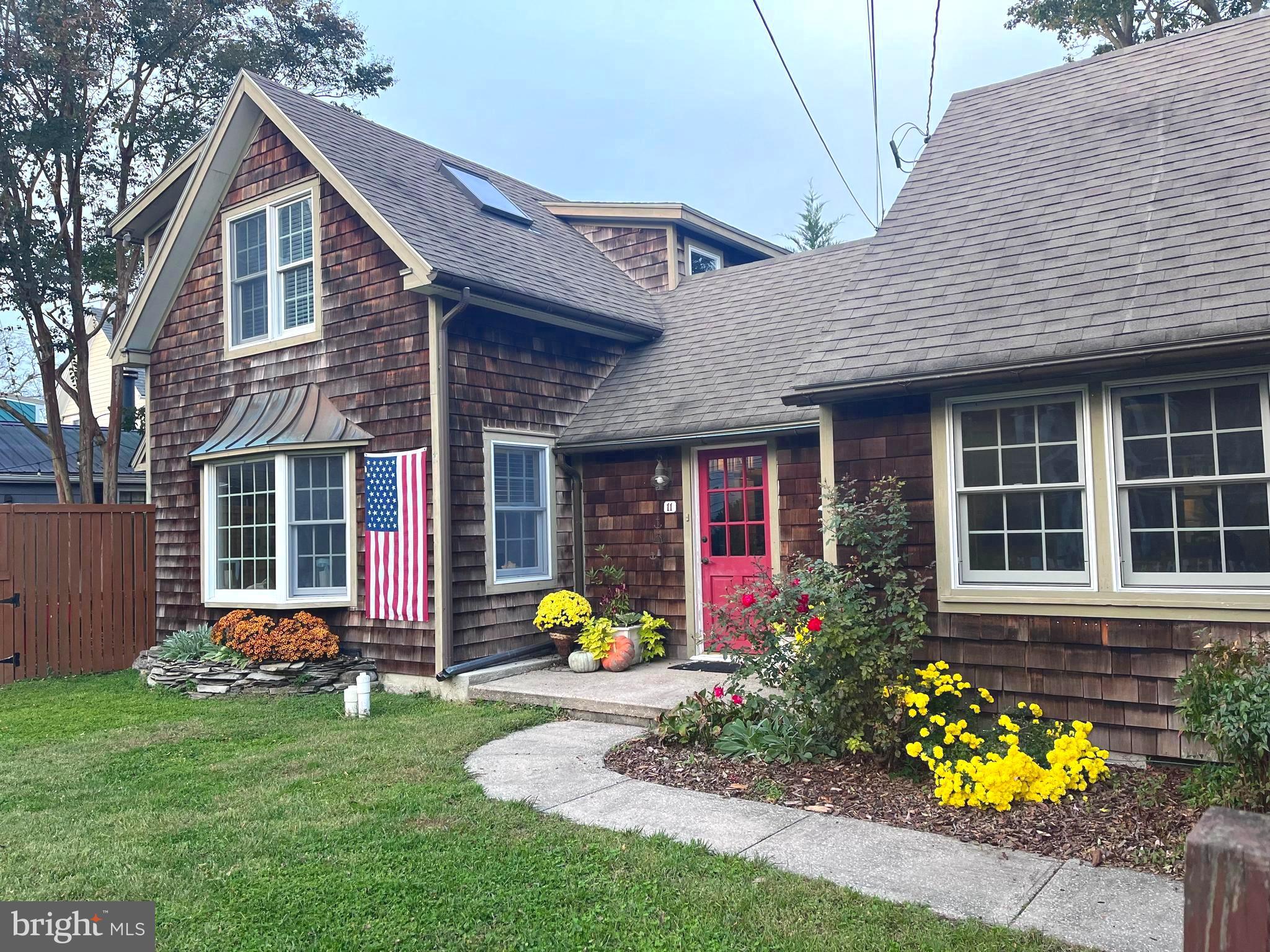 Own a timeless piece of Historic Lewes — where coastal charm, walkability, and rich heritage come together to create one of Delaware’s most sought-after lifestyles. Nestled on picturesque Church Street, this beautifully renovated early-1900s Cape Cod blends classic character with thoughtful modern updates, offering the rare opportunity to live where you can easily walk in the heart of the First Town in the First State. Imagine mornings biking to the beach or grabbing coffee downtown, afternoons exploring the canal and state park trails, and evenings by the fire after dinner at your favorite local restaurant — this is the Lewes lifestyle buyers dream about.

Inside, warm hardwood floors and inviting living spaces reflect the home’s historic roots while providing everyday comfort. A cozy family room off the kitchen and a spacious dining area create the perfect setting for gatherings, while the upgraded kitchen features stainless steel appliances, a gas range, and modern countertops. With three bedrooms and two full baths, the home balances charm with functionality. A wood-burning fireplace adds ambiance for cooler coastal nights, and the attic offers potential to expand living space in the future.

Step outside to a beautifully maintained fenced yard with landscaped gardens, patio space for al fresco dining, and an outdoor shower — ideal after long beach days.  Large oversized shed gives ample space for all your beach gear and additional storage. The private driveway provides off street parking, a rare convenience in Historic Lewes. Whether you’re seeking a full-time residence, coastal retreat, or a legacy property rich with history and character, this home captures the essence of life in Lewes — where every street tells a story and every day feels like a getaway.