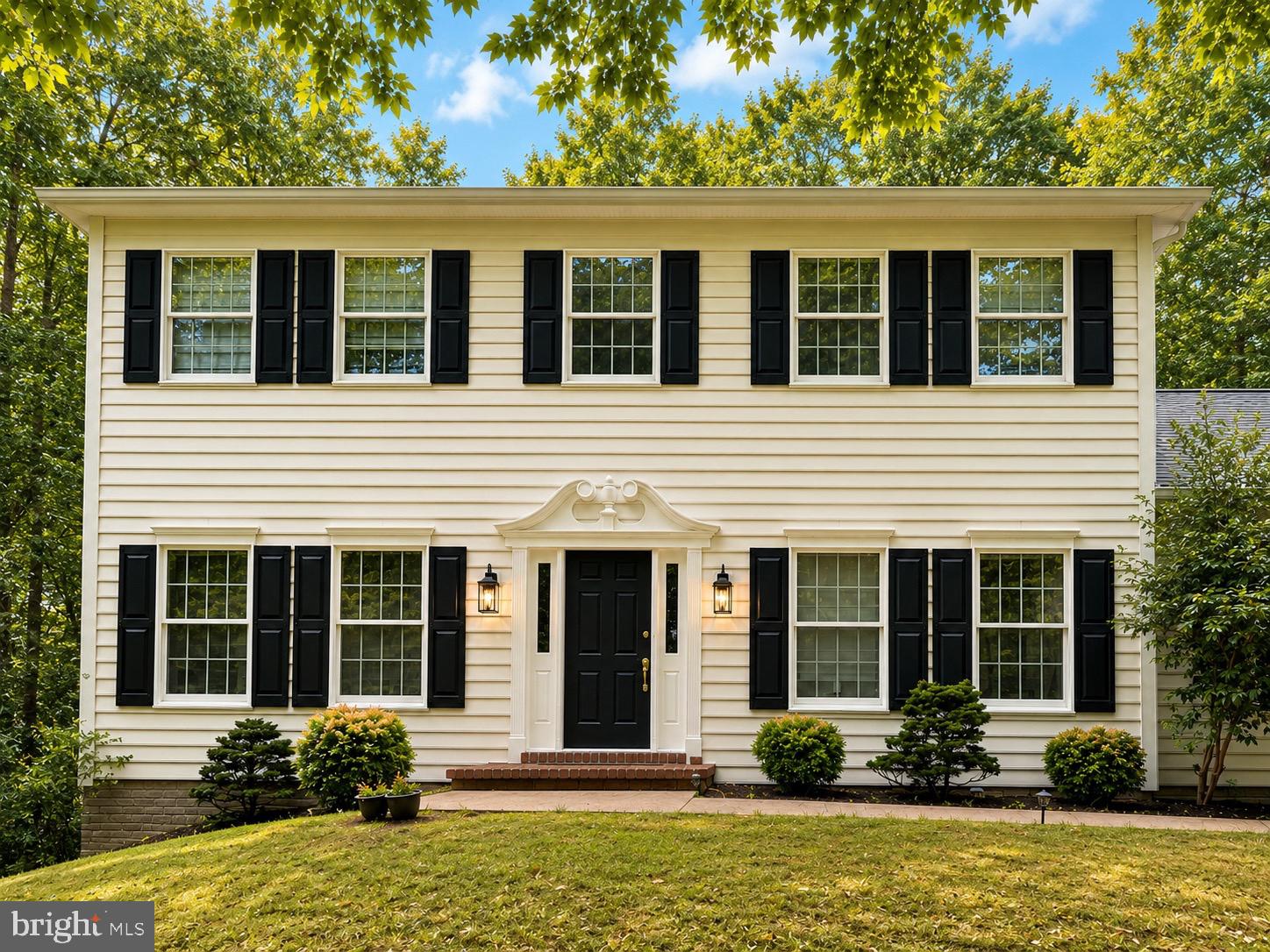 Nestled on 2+ private wooded acres, this thoughtfully renovated colonial blends timeless character with modern updates in a truly move-in-ready package. Highlights include a new roof, a beautifully renovated kitchen with quartz countertops, renovated primary and guest bathrooms, custom solid white oak hardwood flooring throughout, fresh paint, and updated lighting. The main level features formal living and dining rooms, a private office with custom built-ins, a spacious family room with a wood-burning fireplace and custom built-ins, a laundry room, and a powder room. Upstairs offers four generously sized bedrooms and two full bathrooms. The unfinished 1,000-square-foot basement provides abundant storage and exceptional potential for future living space. Enjoy the expansive rear porch overlooking peaceful, tree-lined grounds that offer a rare sense of privacy. Ideally located in the highly sought-after Crofton school district and just minutes from Fort Meade, NSA, DISA, Annapolis, Baltimore, Washington, D.C., and major commuter routes, this exceptional home offers the perfect blend of privacy, space, and convenience.