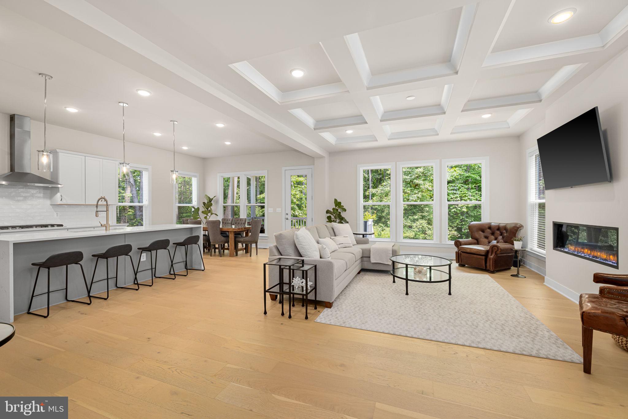 Welcome to 4615 Wood Glen Rd, a modern farmhouse built by Pulte Homes in 2023 and situated on a premium lot backing to protected parkland. This 5-bedroom, 4.5-bath home offers 3,500 finished square feet of light-filled, flexible living space in one of Fairfax’s most charming enclaves.

The main level features white oak hardwood flooring, a private home office, and an open-concept layout that seamlessly connects the great room, dining area, and gourmet kitchen with premium finishes and a walk-in pantry for added storage and convenience. Just off the dining space, a screened porch invites relaxed outdoor living year-round. A charming front porch and a two-car garage featuring a paint-sealed floor and
a second electrical panel makes for an easy electric car charger update complete the home’s welcoming exterior.

Upstairs, the expansive primary suite includes two walk-in closets and a spa-inspired bath with a soaking tub, oversized shower, dual vanities, and a private water closet. Three additional bedrooms, a full bath, and a laundry room with rough-in for a utility sink provide everyday ease and future flexibility.

The finished lower level includes a spacious rec room, a private bedroom, and a full bath—ideal for guests or extended stays—with walk-up access to the backyard. There's also a rough-in for a bar sink, making the space ready for entertaining or a future wet bar.

Located just 7 minutes from shopping and groceries, 15 minutes to Vienna Metro, and 30 minutes to Reagan National Airport. Zoned for the highly sought-after Carter G. Woodson High School, this move-in ready home offers the perfect blend of quality construction, thoughtful design, and a peaceful, connected lifestyle.