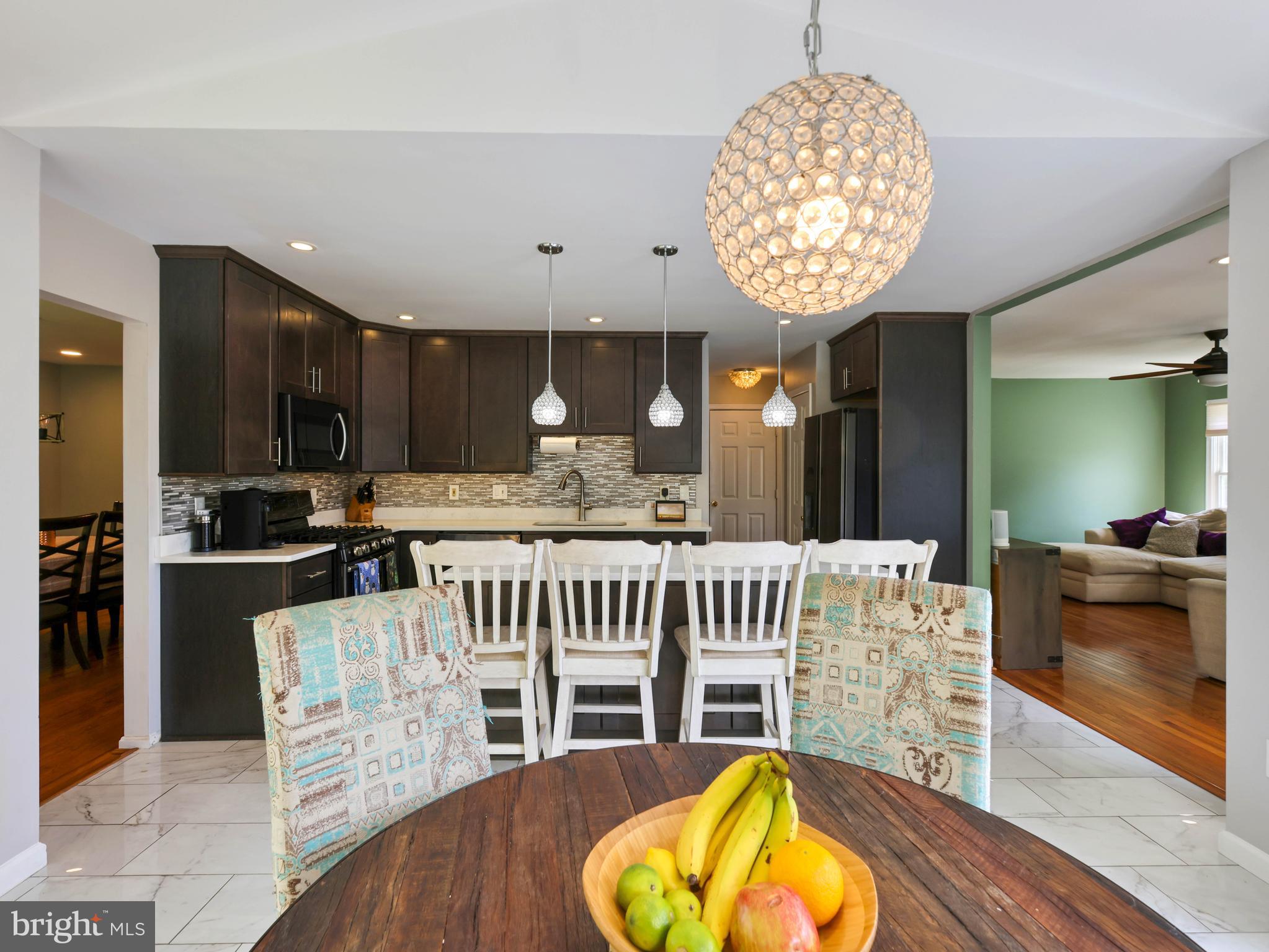 $76,000 in recent upgrades!!
Every major detail has been addressed for a seamless move-in:
•  New Trex deck
 • New backyard fencing
• Brand-new A/C system
• New high-efficiency LG large-capacity laundry
• New dimmable recessed lighting installed in every room
• New built-in power and USB in kitchen island

Welcome to this striking colonial, perfectly positioned on a coveted corner lot in Gaithersburg’s premier Meadowvale neighborhood. With over 3,000 square feet of meticulously maintained living space across three finished levels, this residence offers incredible peace of mind and balances traditional charm with high-end, functional upgrades.

The experience begins in the two-story foyer, a bright introduction to the home’s open and airy floor plan. The expansive family room serves as the home's anchor, featuring rich hardwood floors and a wood-burning fireplace—an ideal setting for quiet weeknights or lively weekend gatherings.

At the heart of the home is the fully renovated kitchen, designed for both the home cook and the frequent host. Features include:
• A large granite island that comfortably seats four and extra cabinets
•  Premium stainless steel appliances
• Custom cabinetry and a large shelved pantry closet
• A sun-drenched eat-in area that flows naturally to the outdoors for a seamless cooking and serving experience.

Transition to the new upper-level Trex deck, engineered for beauty and long-term durability. This premium composite material ensures years of enjoyment with minimal maintenance, providing the perfect platform to capture unobstructed sunset views. Below, the massive backyard offers a sense of quiet seclusion rarely found in the area. Backing to mature trees and secured by a brand-new fence, this private lawn provides a scenic backdrop for relaxation, complete with a dedicated storage shed.

The upper level is headlined by the primary suite, where cathedral ceilings and customizable recessed lighting lend a sense of volume and grace. The en-suite bathroom serves as a personal spa, featuring a jetted soaking tub, dual vanities, and premium finishes. Three additional generously sized bedrooms—each equipped with new lighting—provide the versatility needed for family, guests, or a dedicated home office.
The finished walkout lower level further expands the footprint, offering a large open recreation area, a private fifth bedroom, and a full third bath—ideal for guests or an au pair suite.

Located in one of Gaithersburg’s most accessible pockets, you are just 1.5 miles from the RIO Washingtonian Center, Flower Hill Shopping, and the Montgomery County Fairgrounds. Commuting is effortless with immediate access to I-270, ICC/MD-200, and the MARC train, while local aquatic centers and greenways keep recreation right at your doorstep.

This isn't just a house; it’s a thoughtfully upgraded home designed for those who value both community and a private place to recharge.

Property is equipped with video surveillance.  Audio recording devices are disabled during showings and open houses.