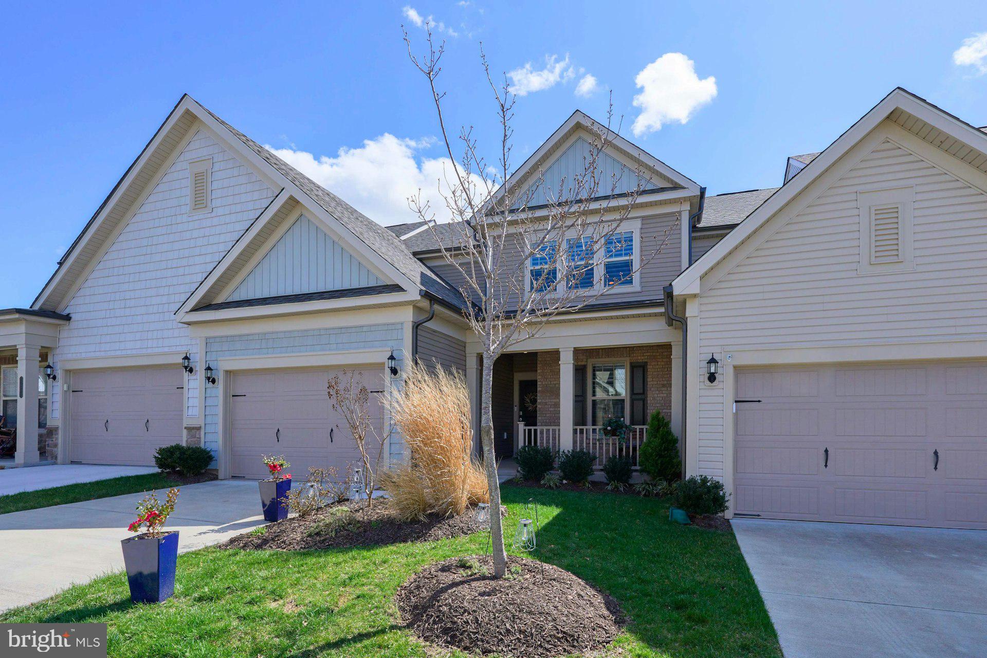 PRICE ADJUSTED!  Welcome to 15563 Blue Lotus Lane in the sought-after Carter’s Mill 55+ community in Haymarket. This beautifully appointed Pulte Willowcroft model offers a spacious two-level design with 3 bedrooms, 3 full baths, and the ease of main-level living with plenty of room for guests, hobbies, and everyday comfort. The gourmet kitchen is a standout with quartz countertops, white cabinetry, Whirlpool stainless steel appliances, gas cooktop, wall oven, microwave, walk-in pantry, and stylish pendant lighting. Main-level living areas feature luxury vinyl flooring, while the bedrooms and upper level offer upgraded carpet, and custom plantation shutters throughout add timeless style and privacy.

The light-filled main-level primary suite offers a peaceful retreat with a large walk-in closet and an elegant ensuite bath featuring upgraded ceramic tile, double sink granite vanity, frameless shower door, and linen closet. Upstairs, you’ll find a generous loft, a third bedroom, a full bath, and a large temperature-controlled carpeted storage room ideal for crafts, hobbies, workout space, or additional flex use. Additional highlights include a main-level laundry room, extra storage under the stairs, Ring doorbell, TV mount above the fireplace, and a one-year paid 2-10 Home Warranty for added peace of mind. This is a wonderful opportunity to enjoy low-maintenance living in one of Haymarket’s premier active adult communities.  Carter’s Mill offers an active adult lifestyle with amenities including a 14,000-square-foot clubhouse, fitness center, indoor and outdoor pools, pickleball, bocce, and many social gatherings and activities.  Plus it’s close to shopping, restaurants, golf courses and major commuting routes.  ALSO AVAILABLE FOR LEASE.