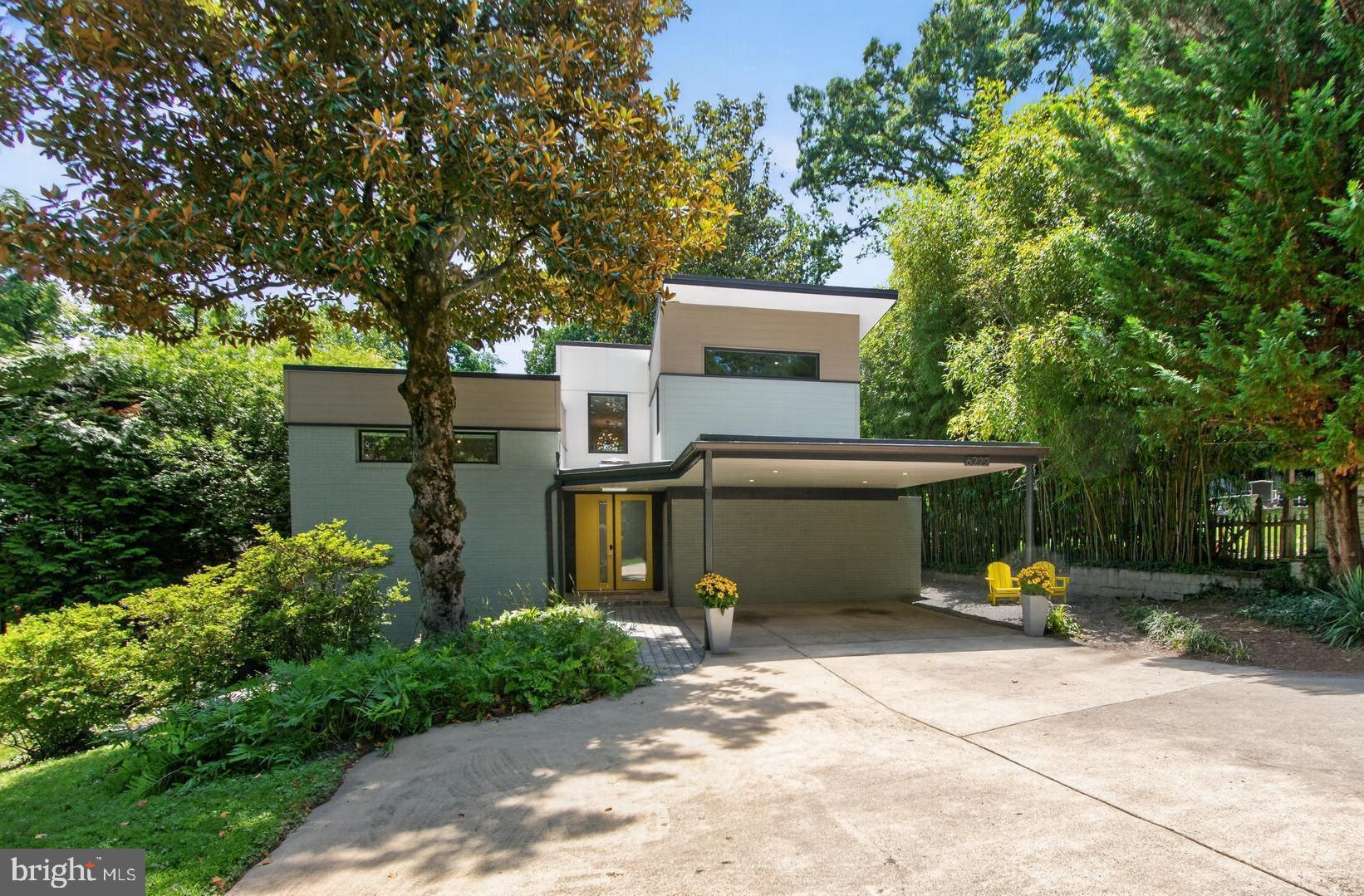 Available for the first time in over 50 years, this cherished four-generation family home represents a rare opportunity to own a piece of architectural history​.  Nestled​ on a private lot among original, mature Magnolia trees, this home stands as an intentional, sophisticated jewel box that perfectly embodies the Swedish concept of lagom—the art of "just enough." It is a masterclass in how premium materials, historical pedigree, and intentional scale can create a sense of luxury within a footprint that respects the lushness of the landscape.  

Architectural Pedigree
The original home was designed in 1963 by prominent Mid-Century Modern architect Stanley T. Lewis to be his own residence. Celebrated for his Bauhaus-influenced work, Lewis is known for local Bethesda landmarks including the original Air Rights Building and 4800 Rugby Avenue.  Lewis built this home using an unconventional, brilliant split-level 9-square grid. This geometry creates a central circulation spine with flanking public and private floors on different levels, optimizing light, flow, and structural artistry - capturing a distinct sense of harmony where every square inch is highly functional and entirely purposeful. 

2019 Addition & Architectural Remodel
A comprehensive remodel and stunning addition were completed in 2019 under the expert direction of Scott Wilets Architecture. Wilets, a renowned Mid-Century Modern specialist and Historical Board member for neighboring Carderock, masterfully bridged the spirit of the original aesthetic with high-end modern functionality and a meticulously curated color palette.  

The "Treehouse" Primary Suite
A spectacular upper-level addition capped with an iconic MCM butterfly roof creates a luxurious, private sanctuary. The large bathroom suite features an elegant double bateau bath with endless on-demand hot water for the entire home supplied by a top of the line Rinnai.  An en suite laundry room is equipped with premium, ultra-reliable Speed Queen top-loading units.  Atop the central staircase at the peak of the home, anchored by an iconic sputnik chandelier, the suite includes an open sitting room bathed in natural light. 

Curated Color Identity
The home’s atmosphere is elevated by custom interior paint colors, exclusively selected by a Farrow & Ball design consultant to maximize natural light and complement the rich architectural woods. 

Bespoke Chef’s Kitchen
The heart of the home has been completely reimagined for the culinary enthusiast, matching clean mid-century lines with a highly tailored, functional workspace: 
Luxury Appliances: Thermador Harmony six-burner range with dual ovens (one convection & one traditional), integrated Miele Master Cool refrigerator, Miele Speed Oven/microwave combination, new Bosch dishwasher. 
Water filtration for the prep sink and refrigerator icemaker that utilizes a Franke Little Butler for on-demand filtered hot and chilled water.
Custom-crafted walnut paneling and floating shelves by Kokeena paired with a striking, sculptural tile backsplash by legendary designer Kelly Wearstler for Ann Sacks. 

Cozy Living Room anchored by a high-efficiency wood-burning stove insert crafted by Drolet in Canada. 

Guest Suite (ADU)
Updated  (2025) Private studio Guest Suite/Accessory Dwelling Unit - positioned away from the main living quarters, this highly versatile space features a separate entrance, kitchenette with a full-sized refrigerator, a full bath, integrated pocket doors to separate the space, dedicated laundry, and an expansive storage/workshop space.

Exterior & Community Amenities 
Premium Exterior Materials: The addition and remodel feature high-performance James Hardie siding.
Custom Architectural Shed: Designed and built by the owner to mirror the lines and butterfly accents of the main house.  Provides expansive, garage-style storage.

Sought after schools  - Wood Acres / Pyle / Whitman
Mohican Hills Pool Membership is negotiable & transferable.