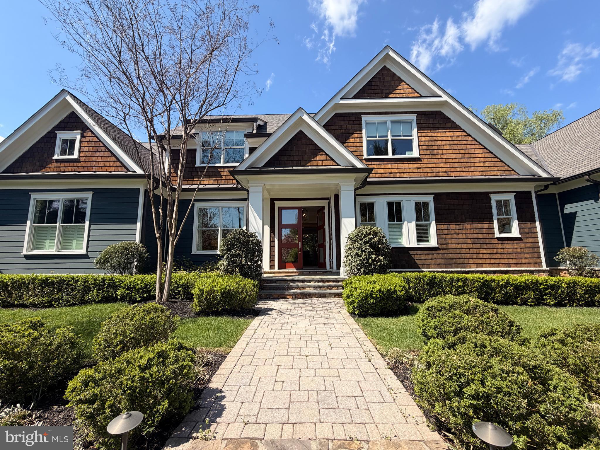 Nestled on beautifully landscaped grounds and privately tucked away in the heart of McLean, this exceptional custom residence by Artisan Builders offers timeless elegance, thoughtful design, and an ideal location. A gracious entrance welcomes you into the formal living and dining rooms, setting the stage for sophisticated entertaining. The expansive family room opens to a chef’s kitchen appointed with top-of-the-line appliances, custom cabinetry, and a charming breakfast nook. Enjoy year-round outdoor living in the screened-in loggia overlooking the picturesque grounds.
The main-level owner's suite serves as a private retreat, featuring dual walk-in closets and a luxurious spa-inspired bath. Upstairs, three spacious bedrooms each offer their own en-suite bath. The walk-out lower level includes a recreation room, game room, additional bedroom, and full bath, providing ample space for guests and leisure.
Ideally located within walking distance of Lewinsville Park and just minutes from McLean High School, downtown McLean, Tysons, Metro access, and major commuter routes.
