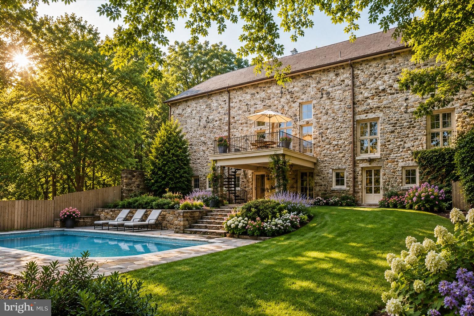 A rare opportunity to own one of Whitemarsh Township’s most distinctive residences. Known as The Peace Barn, this extraordinary home began its story in 1814 as an addition to the historic Highlands barn and mansion. Today, it stands as a remarkable blend of preserved history and thoughtful modern living—a home unlike any other on coveted Sheaff Lane. Tucked away on over two impeccably maintained acres behind a tree-lined drive and surrounded by protected farmland, The Peace Barn offers a level of privacy and tranquility that is increasingly impossible to find. Just moments from Germantown Academy and major commuter routes, the property feels worlds away while remaining exceptionally convenient.

Inside, soaring ceilings, original wide-plank pine flooring, exposed beams, custom built-ins, and three fireplaces create an atmosphere rich with warmth and character. The expansive main living space is designed for effortless entertaining, where an open-concept great room flows seamlessly into the dining area and chef’s kitchen featuring a Sub-Zero built-in refrigerator, generous eat-in space, and handcrafted details throughout. French doors open onto an elevated balcony overlooking the stunning stone courtyard and heated pool. The south-facing primary suite is filled with natural light through oversized Andersen windows and offers a luxurious retreat complete with a spacious walk-in closet, double vanity, steam shower, and oversized jetted soaking tub.

Additional living spaces include a cozy den with a gas fireplace, a private guest suite with its own full bath, and an extraordinary unfinished upper-level studio beneath dramatic vaulted ceilings—an inspiring canvas for a future primary suite, artist’s studio, home office, recreation room, or wellness retreat. The walk-out lower level continues to impress with two additional bedrooms connected by a Jack-and-Jill bath with sauna, a handsome home office lined with custom built-ins, an updated fitness room, custom laundry-room with dog shower, recreation room with wet bar and french doors opening directly to the secluded courtyard and pool.

Modern improvements complement the home’s historic soul, including a DaVinci lifetime composite roof, whole-house generator, three-car garage with workshop, and meticulously maintained landscaping featuring mature trees and pristine grounds. The Peace Barn is an extraordinary residence, offering a rare opportunity for the buyer who appreciates historical architecture, embraces character, and recognizes the rare opportunity to become the next steward of an irreplaceable property. This remarkable estate offers both timeless beauty and endless possibilities for its next chapter.