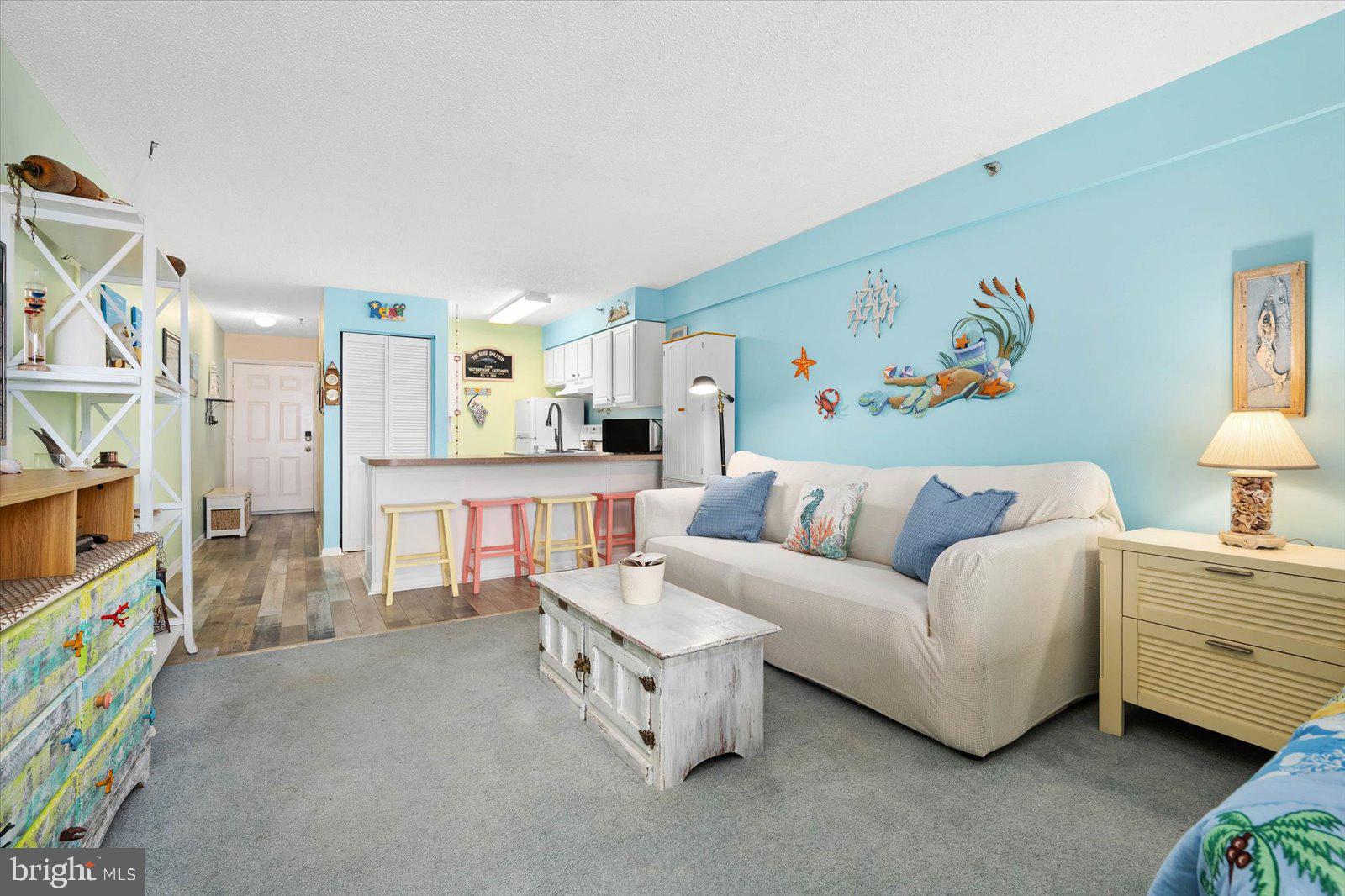 This cute-as-a-button, turn-key, ocean & bayview condo is the perfect opportunity for your beach loving needs! With only being a block from the ocean, it will make it easy to pop down to soak up some sun in the sand or just enjoy the tranquility of watching the waves roll in from the balcony with a drink in hand. You will be hard-pressed to find such an adorable, fully furnished, spacious, studio condo that's ready to move right into and is even an end-unit. There's a stackable W/D in the flat, making it easy to bop back and forth knowing you can be doing laundry passively. There's a queen size bed & a sleep sofa, so you & your family or friends have plenty of room to rest for your busy beach days! There is covered parking, and leave your car where it is for your time on the shore, as so many restaurants, bars & shops are right at your finger tips. You'll easily be able to stroll to Jolly Roger for daytime fun & Seacrets to catch the sunset over the bay. Being right across from the Convention Center makes it easy to catch a show, too. You really can't go wrong with this beautiful studio, which would be great as a beach getaway for yourself or an investment property. Schedule to view while it's still available!