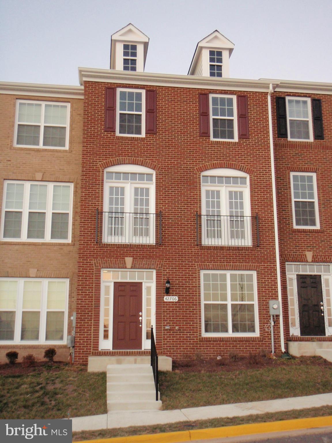 New, Beautiful 4 BR, 3.5 BA Town home with 2-car Garage and lots of extra parking. Common Area in front for uncrowded feeling. Stainless Kitchen with Pantry, Granite, 42" Cabinets, 5-burner gas stove with griddle, convection oven. Upgrades throughout. Great Commuter Location. Close to park-and-ride, grocery, pharmacy, gasoline, shops. Wired for Internet. Community Center, Pool, Tot Lot close by.