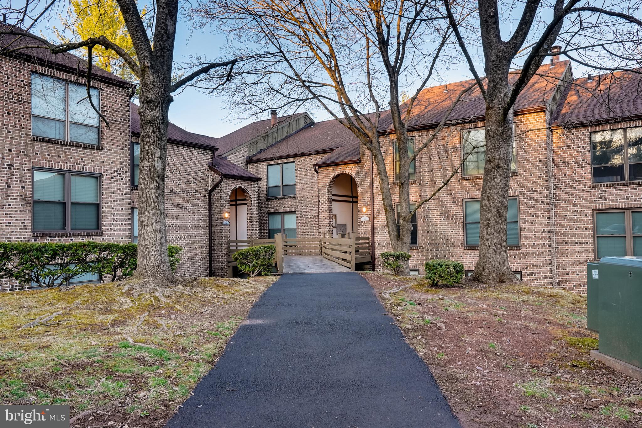 This upgraded Flying Hills condo offers a perfect blend of style and comfort! The kitchen is the standout, featuring glass-paneled lighted cabinets, sleek granite countertops, a stylish tile backsplash, a double sink, hardwood flooring, and stainless steel appliances. Both bathrooms are tastefully tiled, including a walk-in shower in the en-suite. The open-concept dining and living area boasts rich hardwood floors and a cozy wood burning fireplace, creating an inviting space for relaxation or entertaining. A spacious covered balcony with a tiled floor provides the perfect spot to unwind and enjoy the outdoors. And, with newer central air for year-round comfort, and easy access to walking trails, golf, dining, and other nearby amenities, this condo offers a fantastic lifestyle in a sought-after community.