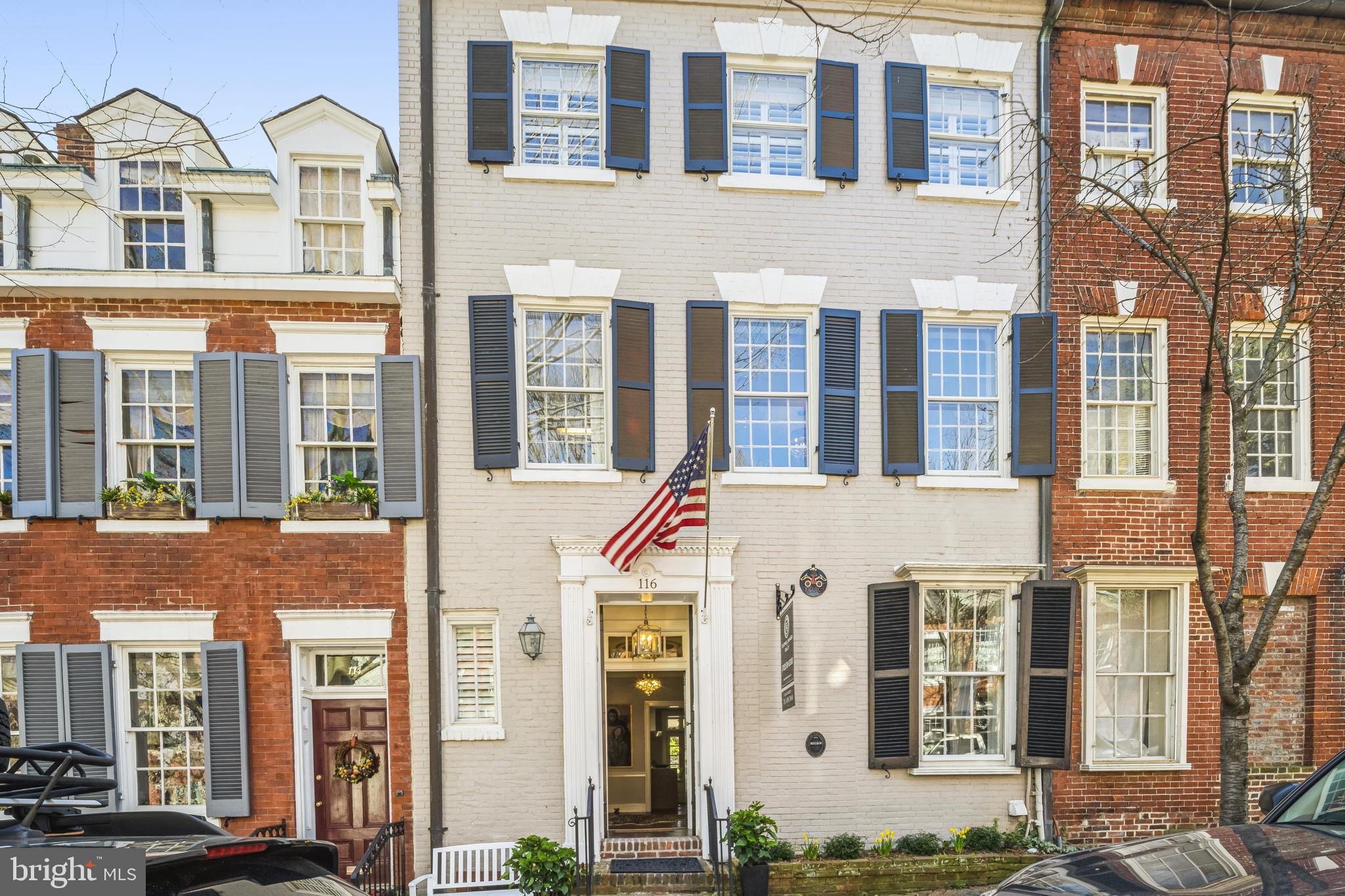 Welcome to 116 Prince St (Circa 1770) This stunning Federal brick townhouse located on famed "Captains Row" in the heart of Old Town has a storied history and has recently undergone a thoughtful renovation. The recent updates maintain the historic character of the home with its original 250 year old heart pine plank flooring and moldings and builds on the European heritage with a Boffi kitchen, Porcelanosa baths and crystal chandelier lighting. There are 5 bedrooms with 3.5 baths and 3 fireplaces in over 4,300 finished SF. The kitchen opens to a welcoming family room with a woodburning fireplace and French doors leading to a charming slate patio with a tiered, walled garden featuring an outdoor living room perfect for entertaining around the gas firepit and private spa. The owners level master suite has a large living room with a fireplace and private deck overlooking the garden. The top floor has been finished to provide a huge game room with windows to Old Town rooftops and the Potomac River. The lower level has been finished with higher ceilings, a spectacular Porcelanosa bath, and a private bar complete with a wine wall and a third fireplace. Just one block from King Street, Captains Row is one of 2 historic cobblestone streets in Old Town Alexandria. Fireplaces have been relined and convey as is. Shown by appointment only.