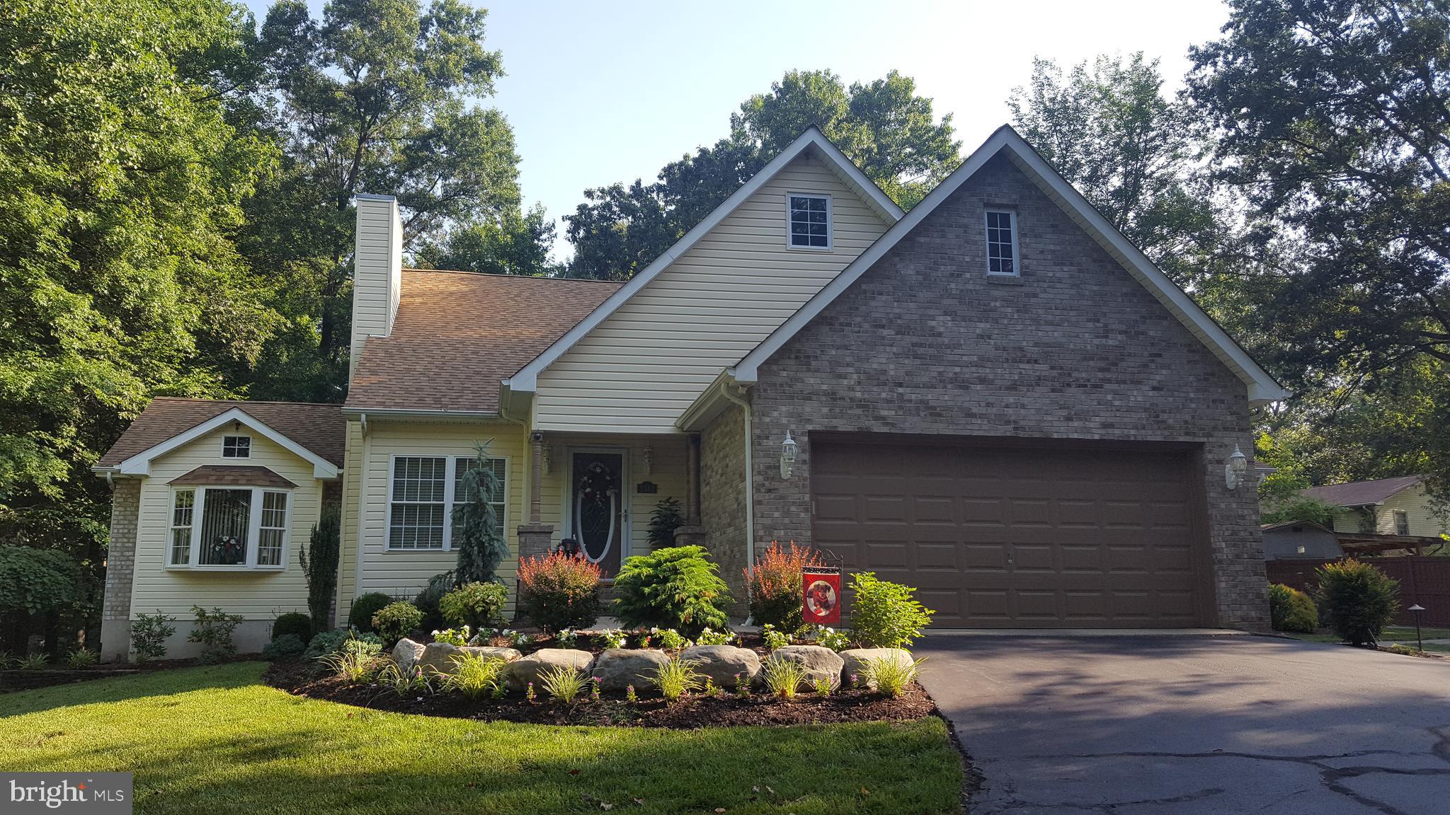 Home Sweet Home! This custom built home comes with lots of privacy and gorgeous backyard retreat. Original owners have modernized this home featuring 20x30 kitchen/sunroom addition, paver walkways/patio, 18x20 hot tub room addition. Gas furnace and hot water heater upgraded in 2015. New roof and washer/dryer in 2019. New kitchen counter tops and Samsung refrigerator.Relax outdoors and enjoy those summer BBQ's, large back yard features fenced in yard, paver patio, lighted pergola and 10x12 amish vinyl shed. 2 car garage is finished with epoxy stronghold floors with plenty of storage cabinetry. 1 year home warranty for buyer!