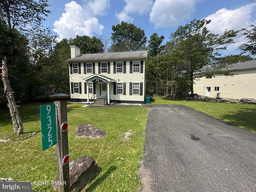 Welcome to this beautifully updated 3 bedroom 1.5 bath colonial nestled on .34 acre lot in a highly desirable, short term rental friendly, amenity filled community. This move in ready home offers the perfect blend of modern updates and timeless charm. Step outside to the large back deck- ideal for entertaining, relaxing or enjoying the peaceful surroundings. Whether you're searching for a full time residence, vacation retreat or an investment property, this home checks all the boxes. Conveniently located near shopping, dining, major highways, and all the attractions the Poconos has to offer!