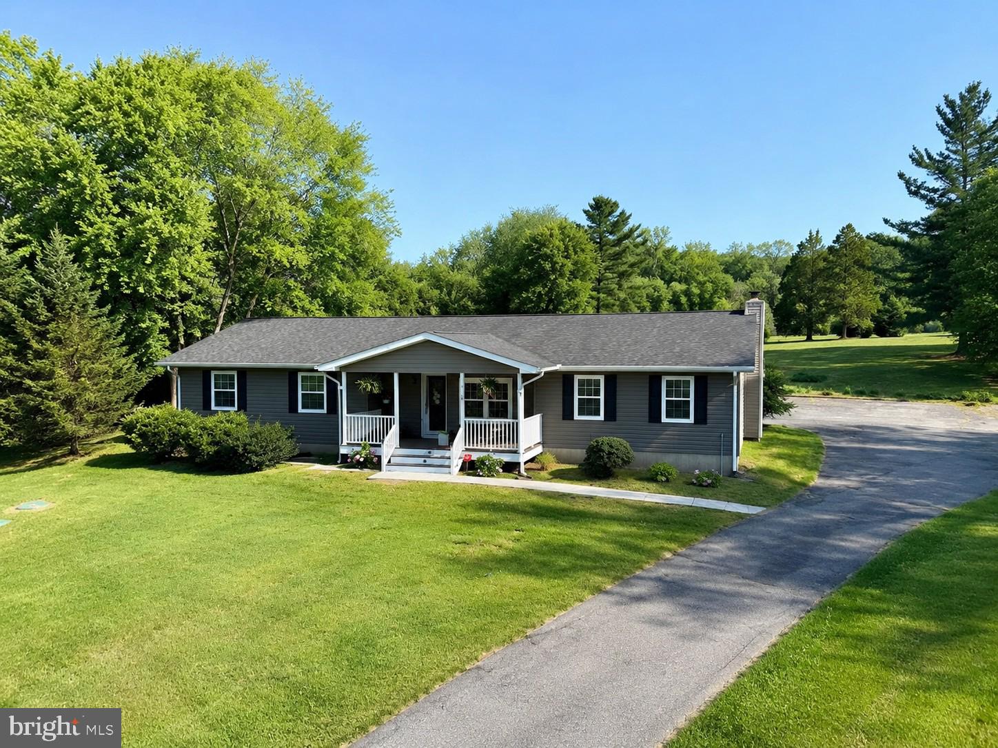 Welcome to your own private retreat on 3.21 picturesque acres in the heart of Middle River. Completely transformed from top to bottom between 2024 and 2025, this exceptional property offers the perfect blend of modern luxury, peaceful living, and incredible flexibility for today's lifestyle.

Unlike many homes on Ebenezer Road that share long driveways with neighboring properties, this home features its own private driveway, offering the privacy and exclusivity buyers have been searching for from the moment they arrive.

Step inside to discover a bright, open-concept floor plan filled with natural light and finished with brand-new luxury vinyl plank flooring throughout. The beautifully redesigned kitchen serves as the heart of the home, featuring quartz countertops, stainless steel appliances, abundant cabinetry, and generous prep space, making it ideal for both everyday living and entertaining. Just off the living area, a cozy reading nook nestled beside the fireplace creates the perfect spot to curl up with your favorite book, enjoy your morning coffee, or simply unwind at the end of the day.

The main level offers four spacious bedrooms and two beautifully renovated full bathrooms, including an incredible primary suite designed to feel like a private retreat. Complete with a spacious walk-in closet and a stunning ensuite bathroom, this space perfectly combines comfort and luxury.

The fully finished lower level expands the home's versatility with a private in-law suite featuring its own private entrance, bedroom, full bathroom, kitchenette, dedicated laundry room, and spacious living area. Whether you're accommodating extended family, welcoming long-term guests, or simply looking for additional flexible living space, this thoughtfully designed suite offers exceptional comfort and privacy. Even better, the layout provides space for the potential addition of a second bedroom, creating even more flexibility for future needs.

No detail was overlooked during the extensive renovation completed between 2024 and 2025. Every aspect of this home has been thoughtfully updated, blending timeless finishes with modern functionality. The home and detached two-car garage both feature brand-new architectural shingle roofs and new vinyl siding, while updated electrical includes separate electrical panels for both the main level and lower-level suite. Brand-new HVAC ductwork was installed in 2024, a new water heater was installed in 2023, and both the front porch and rear deck were completely rebuilt in 2024. Every window is outfitted with custom 2-inch wood blinds, adding warmth and timeless style throughout the home. The result is a home that has been beautifully reimagined! You truly wouldn't recognize it from its previous listing photos.

Outside, you'll enjoy 3.21 acres of beautifully maintained grounds with lush green lawns, mature trees, and plenty of room to relax, entertain, or simply enjoy the peaceful surroundings. The detached two-car garage, expansive driveway, and parking for up to eight vehicles provide ample space for family, guests, work trucks, recreational vehicles, or outdoor equipment.

Conveniently located just minutes from shopping, dining, I-95, and I-695, while also being close to the beloved Richardson Farms, this home offers the perfect balance of privacy and convenience. Located within the highly sought-after Vincent Farm Elementary School district, this is a rare opportunity to own a completely reimagined home where every major update has already been completed.

Luxury, privacy, exceptional craftsmanship, and true multigenerational living, all on over three beautiful acres. This is a rare opportunity to own a one-of-a-kind property that is truly move-in ready.
