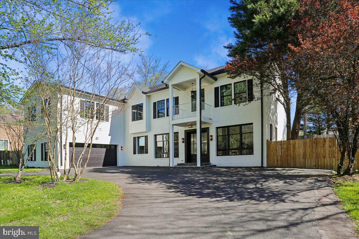 OPEN SATURDAY 7/11  1-3 PM! 
EXCITING NEW PRICE! 
ABSOLUTELY IMPECCABLE 4 LEVEL LUXURY REBUILD IN THE HEART OF POTOMAC VILLAGE

Completely rebuilt from top to bottom in 2024, this extraordinary 6-bedroom, 5.5-bath contemporary home ideally situated in the heart of Potomac Village and zoned for Winston Churchill High School, sits on a beautifully landscaped .43-acre lot with a circular driveway and standout curb appeal. No detail has been overlooked in this impeccable rebuild, with thoughtful details throughout and upgrades that have transformed this home into a showcase of modern design.
From the moment you step inside, the home feels open, airy, and effortlessly welcoming. Sunlight pours through oversized Pella windows, illuminating wide-plank engineered oak floors and refined details like crown molding, modern wainscoting, and soft recessed lighting. The main level is designed for both easy daily living and seamless entertaining, anchored by a stunning chef’s kitchen. Here, an oversized quartz island invites gathering, while custom soft-close cabinetry, a ceramic farmhouse sink, and a professional-grade Bertazzoni six-burner range make cooking a true pleasure. Tucked just behind, a fully equipped catering kitchen ensures you can host everything from intimate dinners to large celebrations with ease. A first floor laundry, mud room, and full bathroom with walk-in shower designed for easy access to backyard and pool are adjoining as well as the entrance from the oversize two-car garage.
The living space flows naturally, with soaring 10 foot ceilings centered around a cozy wood-burning fireplace—perfect for quiet evenings or lively get-togethers. A main-level bedroom with a walk in closet and extra powder room complete this floor.
Upstairs with 9 foot ceilings, the primary suite feels like a true retreat. Wake up to soft natural light, then unwind in a spa-inspired bath finished in marble, complete with a soaking tub, dual vanities, and a glass-enclosed rainfall shower. A dedicated dressing area with his and hers  walk-in closets and its own laundry adds a layer of everyday luxury. A striking circular staircase leads to a massive loft space with LVP flooring suitable for home gym, creative studio, or quiet workspace.
Each of the four additional bedrooms is generously sized and thoughtfully designed. Bedroom 2 with ensuite bathroom with rainfall shower and designer tile details. Bedroom 3, 4 and 5 share a full hallway bathroom with walk in shower and honeycomb tile floor detail.
Step outside and the home transforms into your own private resort. Spend summer days by the beautifully updated swimming pool, host dinners on the expansive patio, or simply enjoy the peaceful setting of lush lawns and garden beds under the stars.
The finished lower level extends the living space even further, with a full wet bar, recreation area, bonus room, and tucked-away nooks that make it ideal for entertaining, relaxing, or hosting overnight guests. Additional upgrades in this home include an electrical system heavy up to 400 amps and all new plumbing/pipes.
All of this is just moments from the shops and restaurants of Potomac Village, scenic parks, River Road, and the renowned Congressional Country Club—bringing together convenience, community, and luxury in one exceptional home.