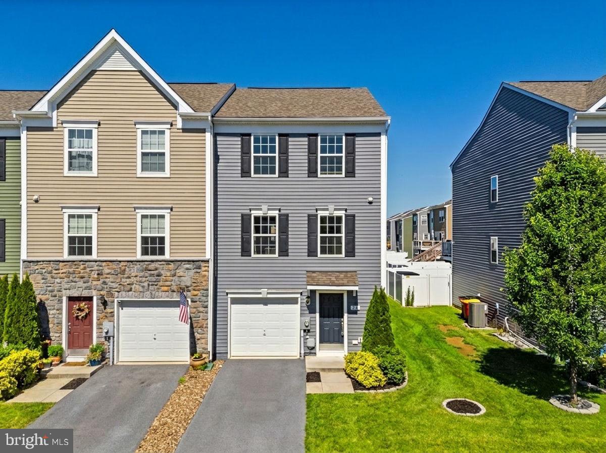 Welcome to 24 Cecily Way, a 3-bedroom, 2.5-bath end-unit townhome in the convenient Briar Run community of Ranson. Built in 2019, this three-level home offers a practical layout, modern finishes, and a location that keeps everyday needs close by. The entry-level features a 1-car garage and a spacious unfinished laundry/utility room, offering valuable storage and flexibility. The main level is designed for comfortable daily living with an open floor plan that includes a living room, family room, dining area, half bath, and kitchen. The kitchen features quartz countertops, a center island, electric cooking, a dishwasher, disposal, and plenty of room for a table and chairs. Luxury vinyl tile adds style and durability throughout much of the home, while carpeting brings comfort to the living room, stairs, and bedrooms. Upstairs, the primary suite offers tray ceilings, a walk-in closet, and a private bath with a double vanity, soaking tub, and walk-in shower. Two additional bedrooms, each with ceiling fan prewire, and a second full bath complete the upper level. Recent improvements include a whole-house filter, water softener, and reverse osmosis system, all added in 2024. Briar Run offers neighborhood play areas and a convenient location near shopping, dining, WV Route 9, and the MARC train station. Just a two-minute walk to shops like Kohls, Marshalls and Weis. With its end-unit setting, thoughtful layout, and approachable price point, this home may also be a great opportunity for buyers exploring down payment or closing cost assistance programs.