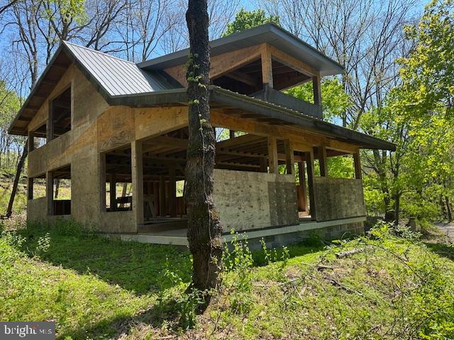 Custom oak post n beam modern rebuild. Open floor plan is luxuriously spacious; high vaulted ceilings, open beams, thick metal roof with generous 2’ and 4’ overhangs, pegged oak joinery, custom plates/hangers. Full basement with garage door, 200A power service, modern well located inside basement, along with a vault room and secure steel door. Mostly just the foundation and hardwood flooring is original, otherwise everything else was built new around 2012. Masterfully designed and overbuilt, easy to finish open palette. Beautiful, wooded property is private, peaceful, and easy to maintain. Located on scenic country roads just a few miles from Kutztown
