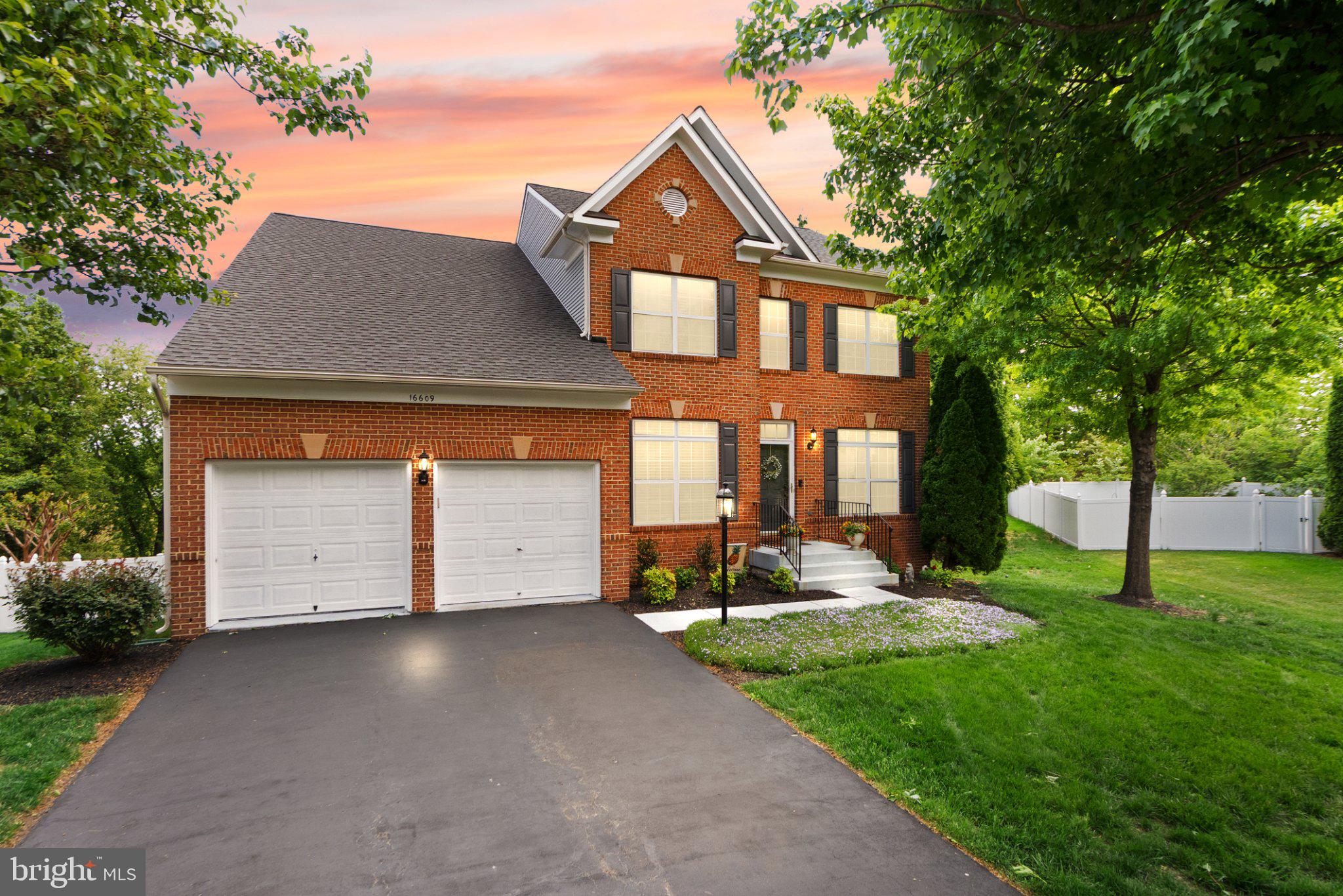 Welcome to 16609 Badger Ct, where timeless design, thoughtful updates, and a true sense of home come together in one of Dumfries’ most connected and desirable communities.

From the moment you step inside, you feel it. Warm hardwood floors, soaring ceilings, and natural light that flows effortlessly through a layout designed for both everyday living and meaningful gatherings. The heart of the home opens into a beautifully updated kitchen with crisp white cabinetry, granite countertops, stainless steel appliances, and an oversized island that invites connection.

Just beyond, the family room is anchored by a striking stone fireplace, creating a space that feels both refined and inviting. It is the kind of room you naturally gather in, whether for quiet evenings or hosting friends and family.

Upstairs, generously sized bedrooms provide comfort and flexibility, while the primary suite offers a private retreat to unwind. The lower level expands the home in all the right ways, featuring a fully finished walk-out basement complete with a kitchenette and a true bedroom, ideal for guests, extended living, or a space that adapts as your needs evolve.

Step outside and you immediately notice the difference. The fully fenced backyard backs to trees with no direct sightlines into neighboring homes, creating a private and comfortable outdoor setting. Whether you are on the deck, patio, or in the yard, the space feels easy to enjoy.
Meticulously cared for and deeply loved, this home reflects pride of ownership throughout, including a brand new roof in 2026 for added peace of mind.

Beyond the home itself, the lifestyle here is what truly sets it apart. Residents enjoy access to a pool, clubhouse, soccer field, and multiple playgrounds, creating a community where connection and convenience come naturally.

Perfectly positioned just minutes from Stonebridge Shopping Center, Potomac Mills, Quantico, I-95, and the future VRE Station, this location offers easy access to shopping, dining, commuting, and entertainment while still feeling like a retreat from it all.

This is not just a home you move into. It is a place you settle into, grow into, and stay for all the right reasons.