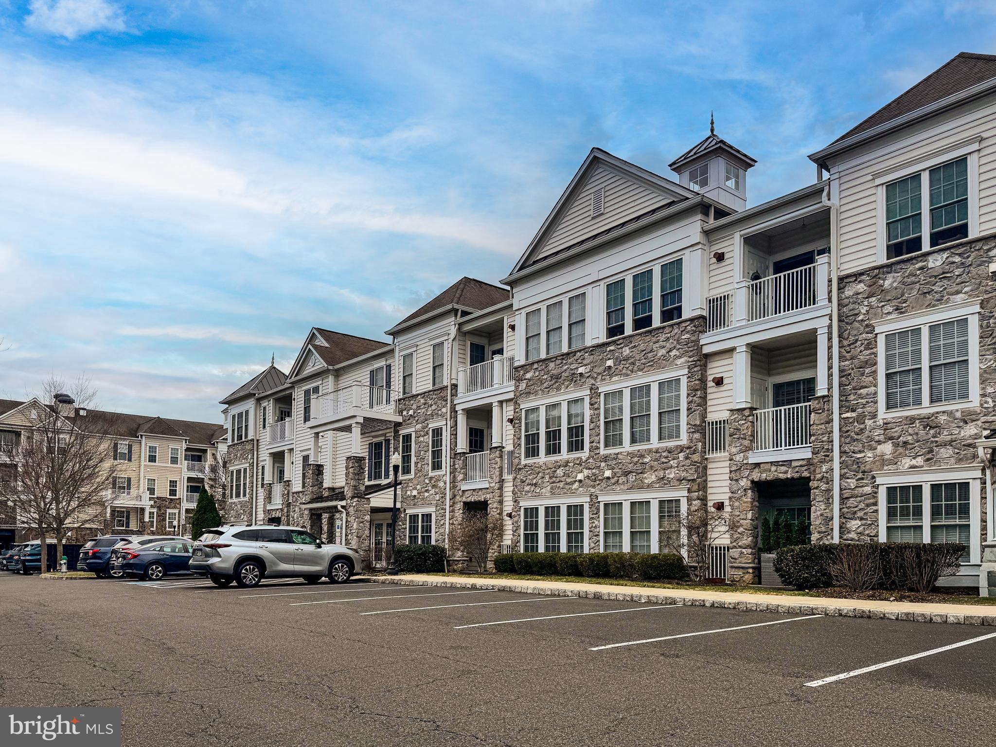 Amazing opportunity to purchase this beautiful 1st floor condo with 2 Bedrooms and 2 Full Baths and a fabulous open floor plan, with hardwood floors and custom millwork, located within the award-winning 55+ community of the Reserve at Gwynedd, offering an active community with outstanding amenities. This rarely offered, freshly painted, Dunnellon model is ideally situated on the first floor, providing effortless access to the exterior without the need for stairs or elevators, making daily living simple and convenient, especially if you have a pet. The welcoming entrance Foyer opens to the Kitchen, Dining and Living Rooms, providing the perfect entertaining flow. The eat-in Kitchen features 42” cabinets, a range with 5-burner gas stove, microwave, new stainless double sink with new faucet and included refrigerator. A stunning Dining Room offers wainscoting, a tray ceiling and chandelier. The incredibly spacious Living Room features a sliding glass door opening to the Patio with utility closet. The Primary Suite with carpet features a tray ceiling, ceiling fan with light and includes a wall-mounted TV. The luxurious Primary Bath offers dual sinks, a soaking tub as well as a stall shower with tiled surround and leads to an extra-large, walk-in closet. The 2nd Bedroom with ceiling fan with light is also generously sized and is located adjacent to a 2nD Full Bath with soaking tub and shower, offering flexibility for guests or a home office. A spacious Laundry Room includes the washer and dryer plus utility sink and cabinets. Other special features include a WIFI thermostat with remote access and new hot water heater ($3000). This garden home also includes a deeded parking space and a storage unit in the underground garage plus unlimited exterior parking. Residents of The Reserve at Gwinnett enjoy exceptional amenities designed to enhance everyday living. The community features both indoor and outdoor pools, allowing you to swim year-round. Stay active in the fully equipped exercise room, or gather with neighbors and friends in the beautifully maintained community and game rooms. The professionally maintained grounds add to the welcoming and resort-like atmosphere. This community provides easy access to excellent shopping in the nearby Blue Bell shopping centers. It is also convenient to Wegmans, Trader Joe’s and Whole Foods. There is easy access to main routes including 202 and the PA turnpike. Enjoy 1st floor living in this low maintenance, vibrant community offering comfort, accessibility and outstanding amenities all at once.