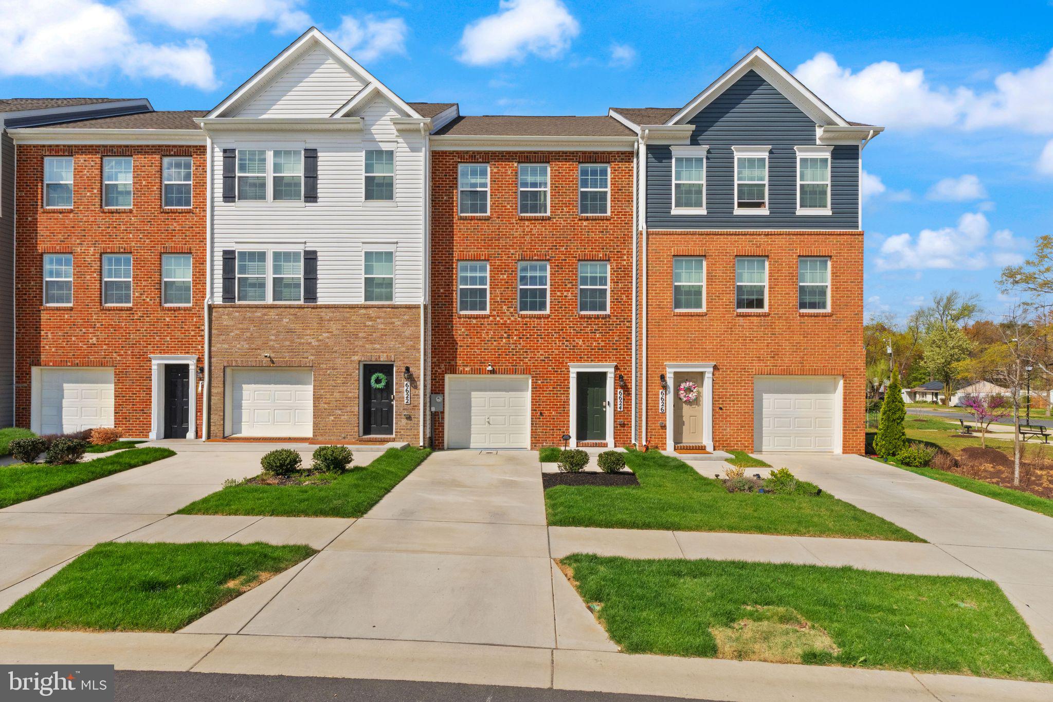 Welcome to the Lafayette by D.R. Horton, a thoughtfully designed interior townhome offering three bedrooms, three full baths, one half bath, and a one-car garage, all complemented by a classic brick front. This well-planned residence combines modern finishes with flexible living spaces to suit a variety of lifestyles.

Upon entry, the lower level welcomes you with a versatile den complete with a full bathroom and a double-door closet, providing ample storage. This space can easily function as a recreation room, home office, guest suite, or additional living area depending on your needs.

The main level is designed for seamless everyday living and entertaining, featuring an open-concept layout that flows from front to back. The kitchen serves as the heart of the home, appointed with rich espresso cabinetry, granite countertops, a contemporary backsplash, and a full suite of stainless steel Whirlpool appliances, including a five-burner gas range, built-in microwave, dishwasher, and side-by-side refrigerator with ice and water dispenser. A large center island provides additional prep space and seating, making it ideal for gathering and daily use. Luxury vinyl plank flooring extends throughout the main living areas, adding both durability and style. The dining and living areas are generously sized, while a conveniently placed powder room offers privacy away from the main entertaining spaces.

Upstairs, the bedroom level features three well-proportioned bedrooms, two full bathrooms, and a dedicated laundry area for added convenience. The primary suite offers a spacious retreat with a walk-in closet and an en-suite bath featuring comfort-height cabinetry, granite countertops, upgraded fixtures, and elegant ceramic tile flooring.

This home is equipped with a smart home package designed to enhance convenience and connectivity, including app-based controls, a video doorbell, smart thermostat, keyless entry, and modular light switches that can be easily customized and upgraded fixtures throughout.

Ideally situated in the Woodyard Station community, this location offers convenient access to major commuter routes including the Capital Beltway, as well as nearby shopping, dining, and public transportation options. Close proximity to Joint Base Andrews further enhances accessibility for a variety of commuting needs.

This home presents a well-balanced blend of comfort, functionality, and modern living in a convenient setting.