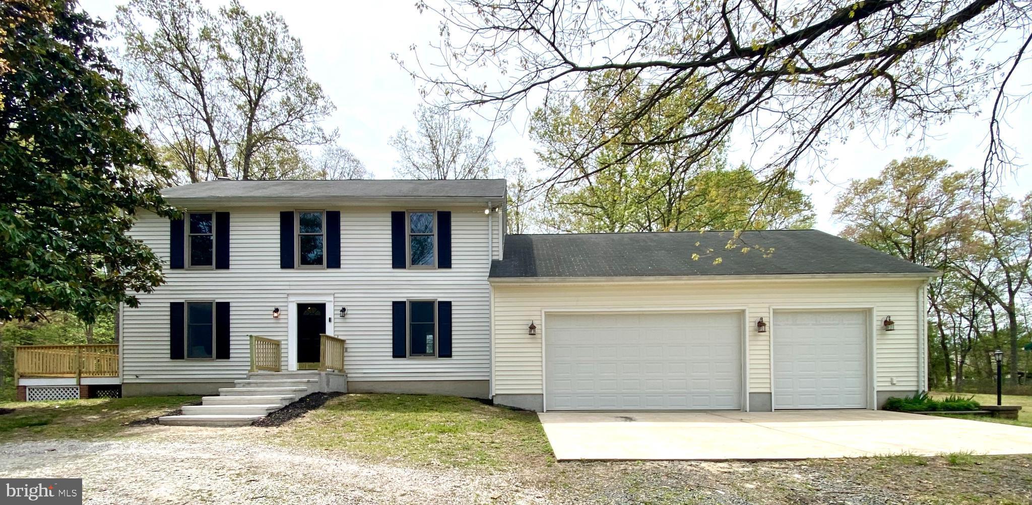 If 6.36 ACRES and the 1,200 sq ft ATTACHED GARAGE are not enough to grab your attention, you'll love the HUGE (2,048 sq ft!!) POLE BARN AND DETACHED GARAGE/WORKSHOP with space for at least 8 vehicles, boats, RVs, or whatever you want or need!     Welcome to 525 Upton Road, a stunning 4 bedroom, 2 1/2 bath home nestled on a 6.36 acre very private lot in Severn. This private, tranquil property offers a secluded retreat with delightful outdoor space, yet it’s conveniently close to all that the I-97 corridor and surrounding areas have to offer!  With its serene setting, your home will be surrounded by a combination of wooded and open yard areas, providing a peaceful backdrop while remaining close to schools, shopping, and restaurants in the area.    As you step inside, you are immediately greeted by an open layout, where the living room, family room, and kitchen effortlessly flow together.  The living room provides access to your side deck, where you can enjoy beautiful views of your expansive yard. The kitchen features new granite counters, a lovely bay window allowing for natural light, and a spacious island, offering opportunities for meal prep or casual on-the-go dining, while the formal dining room is perfect for hosting family gatherings or special events and could easily become a work from home office space. For added convenience, the laundry is located on this level and there is a well-positioned powder room as you enter from the garage.  Hardwood floors are found throughout this main level and you'll love the fresh neutral color palette selected.  You have access to the attached, oversized garage, which is not only spacious and well-suited for your daily vehicles but also provides fabulous storage opportunities with direct access to the home.    Upstairs, the primary suite offers a relaxing haven and is complete with a large walk-in closet and an updated en suite bathroom, featuring modern finishes and fixtures. The upstairs level also features three additional generously-sized bedrooms, along with an updated hall bath.  The lower (basement) level is unfinished and ready for anything you dream of making it!     One of the standout features of this property is the large pole barn, home to your detached garage with two large garage doors (32’x64’, half enclosed). The pole barn also has owned solar panels on the roof, making the property energy-efficient and environmentally conscious. Whether you need additional storage, a workshop, or space for outdoor activities, the pole barn provides endless possibilities.    The expansive yard offers privacy and tranquility, with plenty of room for outdoor recreation. The lot provides space for gardening, entertaining, or simply relaxing in the quiet surroundings.    Conveniently located right off of I-97 and exceptionally convenient to Route 100, 695, and 295, this property offers easy access to local amenities, including the Annapolis, BWI, Fort Meade, and the numerous parks and trails in the area, making it the perfect blend of seclusion and accessibility.    With so much to offer, 525 Upton Road is a unique opportunity to own a beautiful home in a prime location. Don’t miss your chance to experience this fantastic property!
