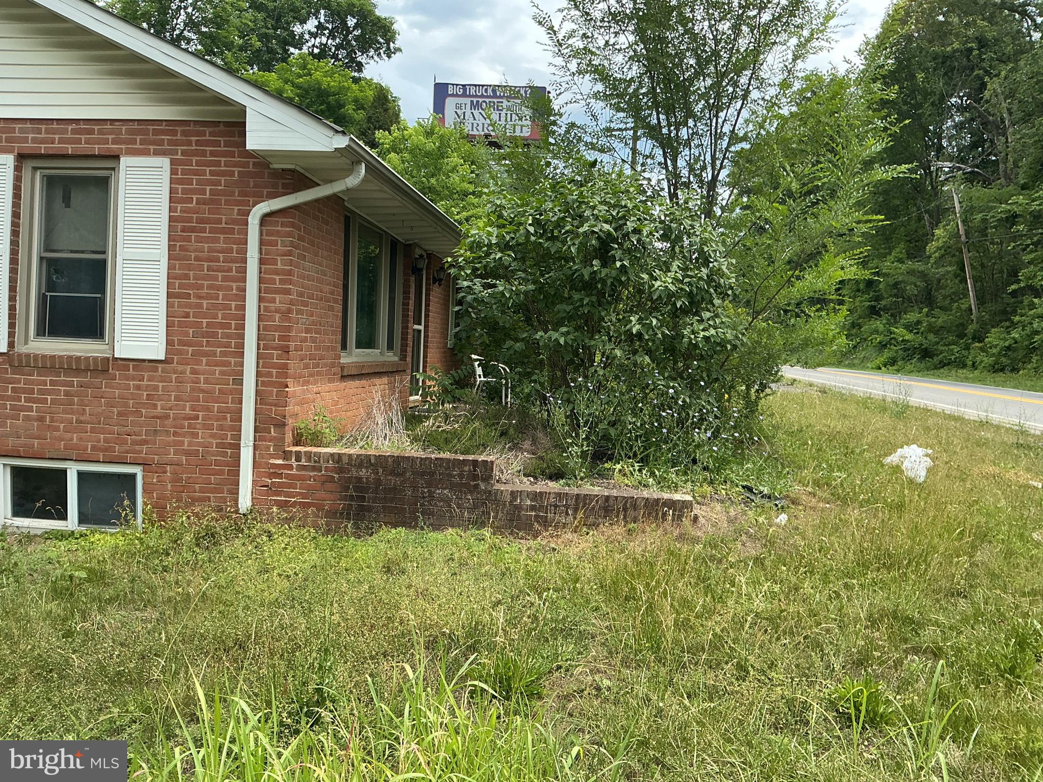 This 3-bedroom, 2.5-bathroom brick property in Martinsburg offers 2,085 sqft of versatile living space. The interior highlights classic hardwood flooring, a partially finished basement, and a kitchen with hard stone countertops and stainless steel appliances, including a newer fridge and dishwasher. Enjoy efficiency with a refurbished central A/C/heat pump system with new vent lines, plus a new well pump. Outside features a 1-car attached garage, a solid block foundation, two storage buildings, an above-ground pool, and a spacious deck with a gazebo perfect for entertaining.