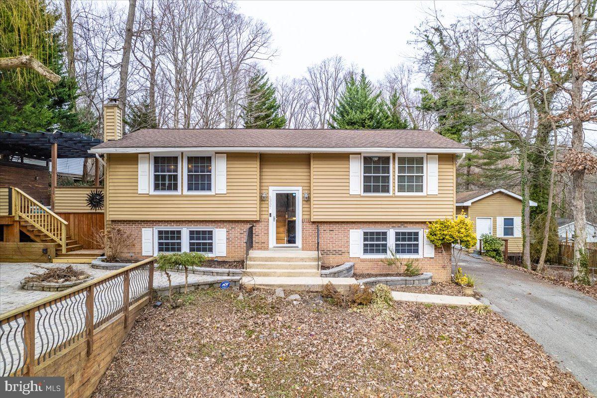 This is a absolute must see over 1800 square foot move in ready home in highly sought after Calvert Beach subdivision.  This house has been updated over the years to become a masterpiece.  The upper level has hardwood floors throughout.  The kitchen is magnificent with granite counters, high end cabinets, stainless steel appliances, backsplash, wine cooler and ceramic tile.  The family room is large and has built in shelves and ceramic accent wall perfect for daily family gatherings and entertaining friends and family.  The owner's suite is a must see, with 2 large areas, walk in closet, ceramic shower, large jacuzzi tub and high-end vanity.  Lower level boasts 2nd huge family/rec room area, large full bathroom and 2nd and 3rd bedrooms.  The outside is fantastic with oversized driveway perfect for multiple vehicles and or boat storage.  The front and side yard have gigantic deck and patio areas that are unbelievable.  The house is close to beaches and parks and just an awesome place to live.  House will not last.