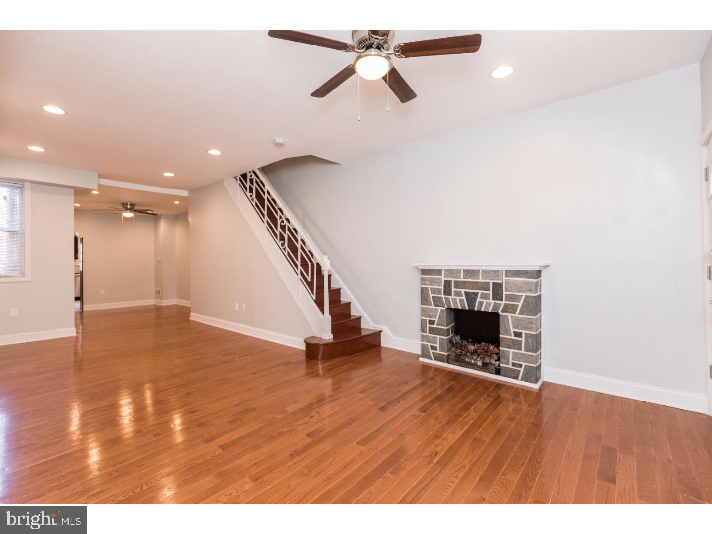 Welcome to 3276 E Thompson st! An impeccably rehabbed and charming porch-front rowhome that has many amazing original features as well as all the modern amenities that you desire. Handsome brick front, highly sought after front porch, large rear yard, and hardwood floors throughout are just a few of the great luxuries this home can boast. The open layout living room has high ceilings, recessed lighting, effusive natural light, and a decorative, non-functioning fireplace. The formal dining area follows into the beautiful modern kitchen with granite countertops, dark brown wooden cabinetry, matching stainless steel appliances, breadstick style tiled backsplash, and access to the large cemented rear yard. The master bedroom featuring custom built in closets takes residence on the second floor along with two other generously-sized bedrooms with ample closet space as well as the full hall bath. Fully finished basement with laundry area, room for storage and yet another full bath. Situated on a great block that is close to all of the amazing shopping & dining attractions of Port Richmond, and also very convenient to public transportation and major highways. Schedule your showing today!