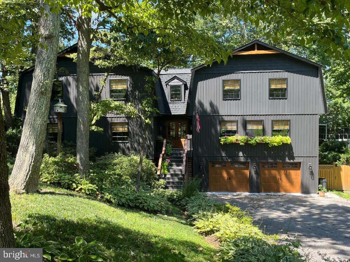RARE find in the coveted Round Bay water-privileged private resort community on the Severn River. This 5600 sqft 5 bedroom with 2 ensuites, 4 bath home has been luxuriously designed with form and function in mind. This ONE-YEAR young home is tastefully equipped with high-end materials, state-of-the-art mechanicals, designer fixtures, breath-taking kitchen and baths, and a true craftsman-designed center staircase that will delight for years to come. Award-winning Severna Park School district, excellent private school, and secondary education options further increase the value of Round Bay’s location. Experience the dream of the Chesapeake Bay lifestyle living in Round Bay. 18 Severn River is a gate away from the water’s edge and kayak racks, seven houses from tennis courts, and 5 homes from the magnificent main beach and PICKLEBALL on the Severn River. Enjoy Summer Beach and sailing camps, Swim Team, swim lessons, tennis camps, community dinners, happy hours, dances, and more. Nature and health enthusiasts have access to a community walking path and nearby B&A trail that leads to shopping and restaurants. Water enthusiasts will have access to 3 deep water beaches, two with their own pavilion, 3 deep water piers, Boat Slips, and moorings (confirm availability with community), kayak racks, and boat ramp. 

Property Highlights:

Vaulted Great Room: Step into the heart of the home - a breathtaking vaulted great room that will leave you in awe. 

Entertainer's Dream: The great room features a custom bar (conveys), a cozy fireplace, raw-cut wood beams that add rustic charm, and an abundance of natural light. 

Contemporary Elegance: This home is a showcase of contemporary elegance, with high-end finishes that leave no detail untouched. 

Low Maintenance: The exterior has been thoughtfully designed with low-to-no maintenance materials, allowing you to savor your coastal lifestyle without the burden of extensive upkeep. Manufacturers Warranties on building materials (shingles, siding etc.)

Outdoor Oasis: Situated on an oversized flat lot, this property boasts lush, mature landscaping and even includes a charming chicken coop. Parking is a breeze with a spacious 2-car garage and room for up to 6 vehicles.

Multiple Fireplaces: In addition to the great room's fireplace, this home offers two more fireplaces, creating inviting spaces throughout for relaxation and enjoyment.

Open Concept: The open-concept design seamlessly connects living spaces, making it ideal for hosting gatherings, whether they are grand soirées or intimate family moments.

Luxurious Master Suite: Private retreat awaits in the Primary 27x19’ suite, complete with its own fireplace, a generous walk-in closet, and a spa-like bathroom that exudes tranquility. Two custom armoires convey.

Lovely Secondary Suite – Large 18’x15’ enjoys excellent natural lighting and a lovely private bath.

Acclaimed Schools: Award-winning school district, excellent private school, and secondary school options.

Culinary Dream: The kitchen boasts quartzite countertops, stainless steel appliances, custom cabinets with tons of storage, dual pantries with rustic doors offer additional storage, banquet seating for ten (custom table conveys), and high-end lighting.

Convenient Location: The nearby bike path offers easy access to downtown restaurants and shopping, allowing you to explore the vibrant local scene with ease. Only 6 miles to Annapolis, 15 to Baltimore, and 25 to DC.

Schedule your private tour today to experience the lifestyle that comes with this exceptional coastal retreat. Your dream home is here, waiting for you to make it your own. Experience the magic of coastal living in this extraordinary property.
Agent review Agent remarks for offer instructions