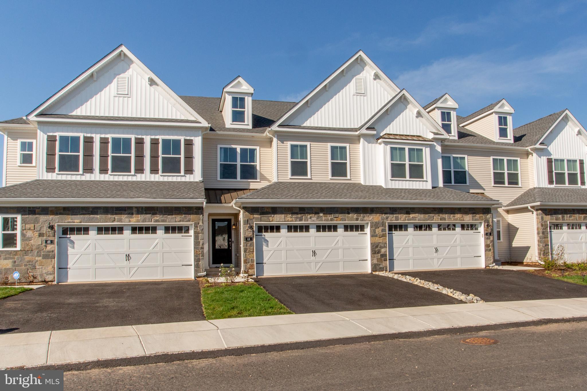 Welcome to this premium location in the Reserve At Spring Mill.  Overlooking the wonderful golf course of the Spring Mill Country Club from the deck you will appreciate the serenity and views.  Built last year, this beautiful 3 bedroom 2.5 bath townhouse provides you with a bright and airy wide open floor plan encompassing the kitchen, living room and dining area with sliders to the back yard and the views.  This open concept is perfect for your everyday living as well as gatherings and entertaining.  All of the flooring, main and upper level, have been thoughtfully upgraded to the desirable dark hardwood.  Meal preparation will be a delight in this exceptional kitchen featuring an abundance of cabinets, quartz counters, stainless appliances, gas cooking, a range hood, tiled backsplash and a large walk-in pantry.  The large island provides even more workspace and includes seating for casual dining.  Upstairs, double doors lead to the spacious primary bedroom which also overlooks the golf course and features crown molding and a large walk-in closet.  The primary bath includes a double vanity, fully tiled shower and a linen closet.  Two more bedrooms include double width closets and the hall bath also is highlighted with a double vanity.  All bedrooms have been pre-wired for ceiling fixtures and the convenient upper level laundry room completes this floor.  The unfinished basement includes a built-in egress window and is ready for finishing to meet your needs.  Two car garage and a transferable balance of the builder’s one year home warranty.  Conveniently located with nearby shopping, dining, parks, and commuter routes.  Award winning Council Rock School District.