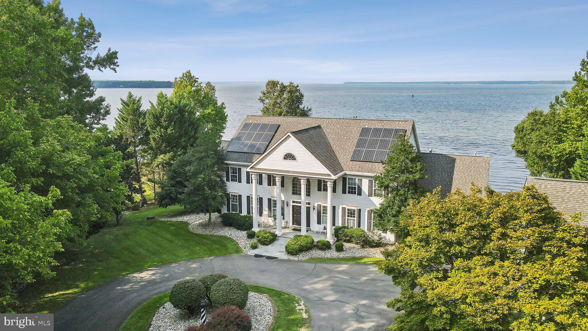 HOLIDAY SPECIAL!!!
\
SELLER OFFERING $100,000 DECORATING ALLOWANCE  ON OFFER RECEIVED BY 1/12/2025!!

Back on Market! Buyer couldn't close. 

Welcome to the luxurious waterfront oasis at 34 Drummers Cove! This home is a rare opportunity to own a stunning, meticulously maintained piece of your own paradise on the Potomac River. 

Situated on 3 acres with over 200 feet of water frontage, you have access to your own private sandy beach, extending the length of the waterfront - always perfect for finding shark teeth - as well as a private dock with 3 boat lifts, recently extended to accommodate larger boats. 

The home sprawls over 8,000 square feet on three levels of exquisitely designed living space. Marble flooring adorns the two-story grand entrance, leading you into the parlor with panoramic river views. To your left, large living spaces line the rear of the home, each space giving just as unique of a living experience as it does a waterfront perspective. On the opposite wing of the home, you’ll enjoy a large open kitchen, with updated cabinetry, appliances and floor to ceiling windows that overlook the pool as your view extends out to the river. Enjoy evenings in the four-season room while overlooking the terrace and across to the Maryland shore. 

Upstairs, each of the four bedrooms has its own ensuite bathroom. Watch the sunrise each morning from the primary suite encompassing a sitting area and a cozy fireplace. The lower level of the home boasts a gym, meditation room with sauna, a large gaming room and a custom pub that - imagine this - overlooks the river! Includes new, never used Generac automatic backup generator so you are never without power!

The home has it all… Truly an entertainer's dream - perfect for making memories, entertaining, and hosting large family gatherings.