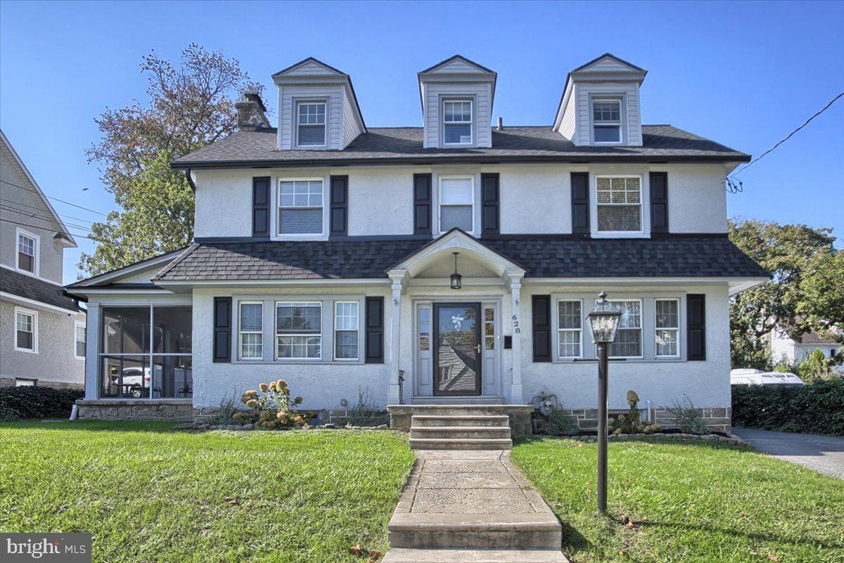 You won’t outgrow this stunning center hall colonial home! As you enter the inviting front foyer, to the left you will find living room with gas stone fireplace and beautiful hardwood floors. French doors lead out to a screened in porch perfect for enjoying those warm nights. To the right there is a formal dining room which leads into a gorgeous updated eat-in kitchen with plenty of cabinets, quartz countertops and stainless appliances. Going back thru the hall toward the stairs is an updated half bath. The second floor offers Main Bedroom with recently remodeled Master Bath en-suite with double sink and glass stall shower and  also two closets. Just off the Main bedroom is the 2nd floor laundry with newer frontload washer and dryer. The second floor offers 2 more good size bedrooms and an updated ceramic tile hall bath. Stairs lead to the third floor which has 2 more bedrooms and yet another updated ceramic tile bath and some storage space. For additional living space, the finished basement is beautiful and has newer carpeting. Love the outdoors? Rear sliders lead to a wonderful Trex deck perfect for relaxing or preparing a Summer BBQ and private fenced yard behind the house. Driveway leads up to a two car garage with raised flooring for use as a home gym or remove the flooring to keep your car safely tucked away. This home has newer central air conditioning and gas hot air heat and a new roof installed in November of 2020. Conveniently located minutes from major highways (Rte 1, Rte 3 and I-476), shopping and the Philadelphia Airport.