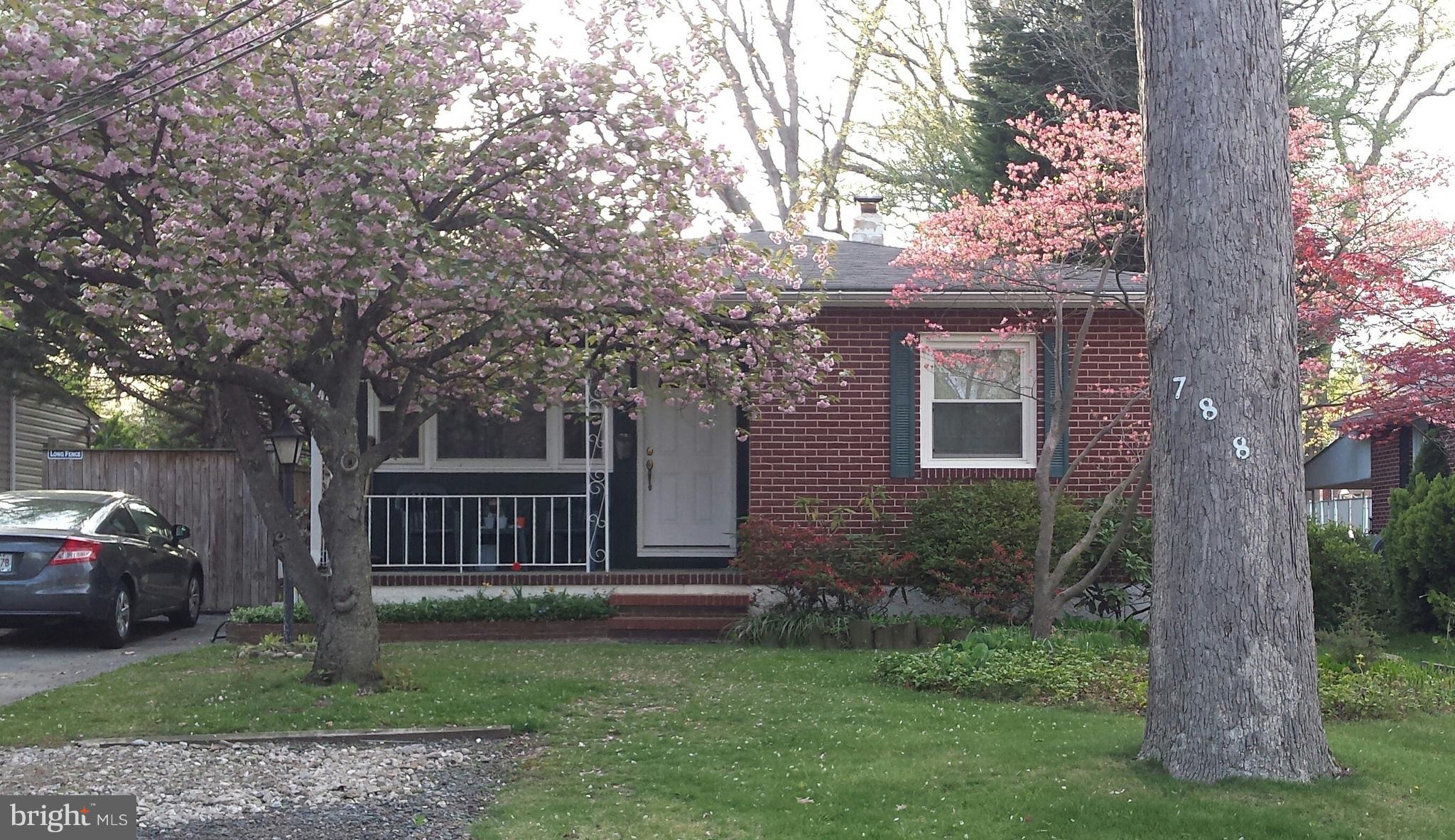 Enjoy your new home on a quiet street.  This home features 3 bedrooms, eat in kitchen, living room and a large sunroom/family room on the first level.  The lower level has a partially finished room, full bathroom and storage area.  Well maintained.  Nice level lot. Wood Stove in as is condition.