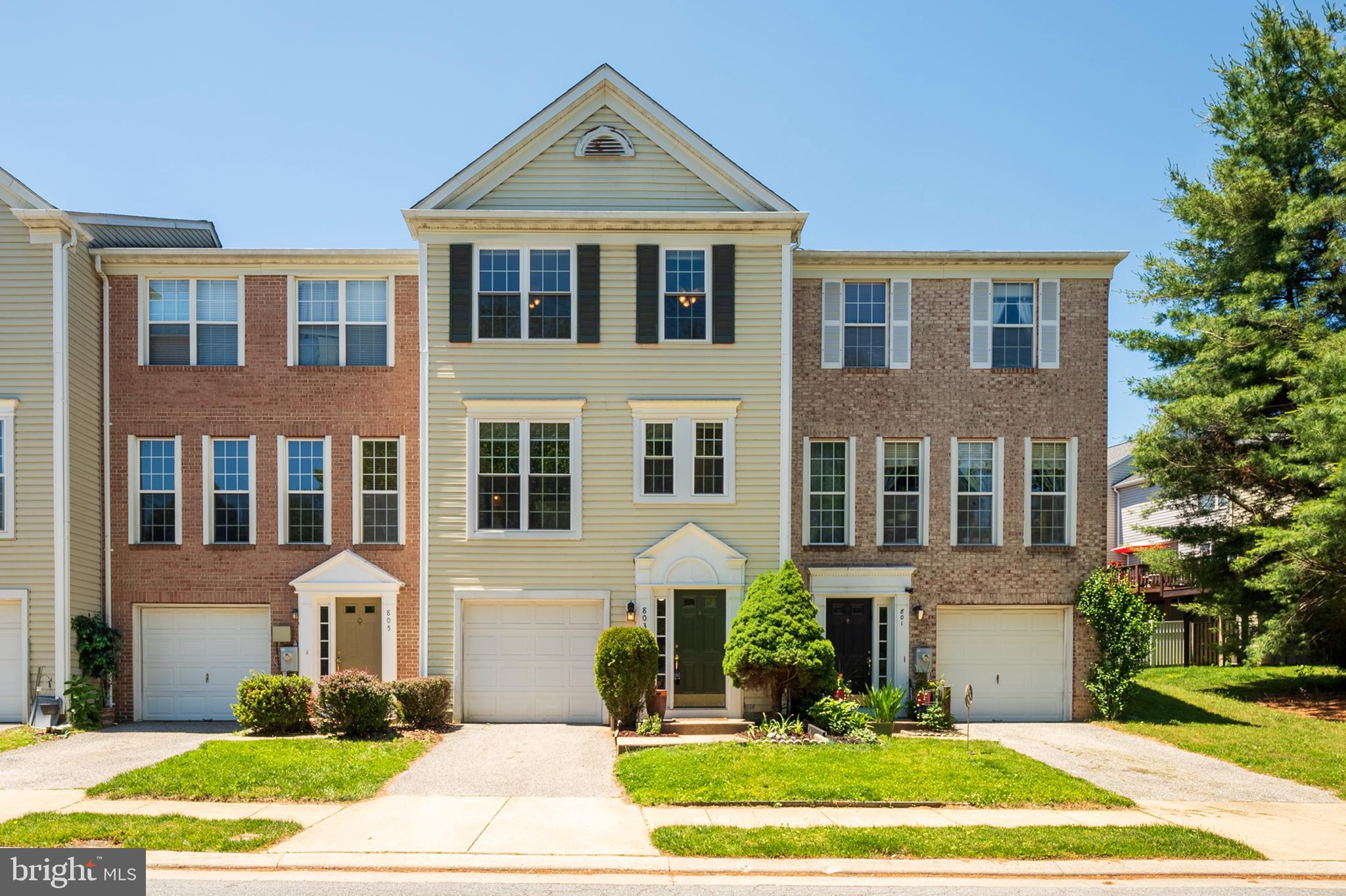 Lovely home in a wonderful community! This townhome has everything you need to from comfortable living, to active community life, and convenient location. Sellers have lovingly maintained the home which boasts brand new carpet throughout, as well brand new LVP flooring upstairs and newer LVP as recent as 2023 and new tile floor in the upstairs hall bathroom.   New fence installed in 2025, and a brand new, fully renovated  half-bath on the lower floor! Enjoy private parking with your very own attached garage and driveway. The deck just off the dining room  overlooks a grassy courtyard, and the cul-de-sac location further underlines the peace you will enjoy as you enjoy cookouts in the evenings or sip your coffee in the morning. The  flex room in the basement can be whatever you envision - a relaxing den, fitness room, additional storage - you name it! The low HOA fees provides access to the community pool and tot lots so the whole family can enjoy the sunny weather however they want.