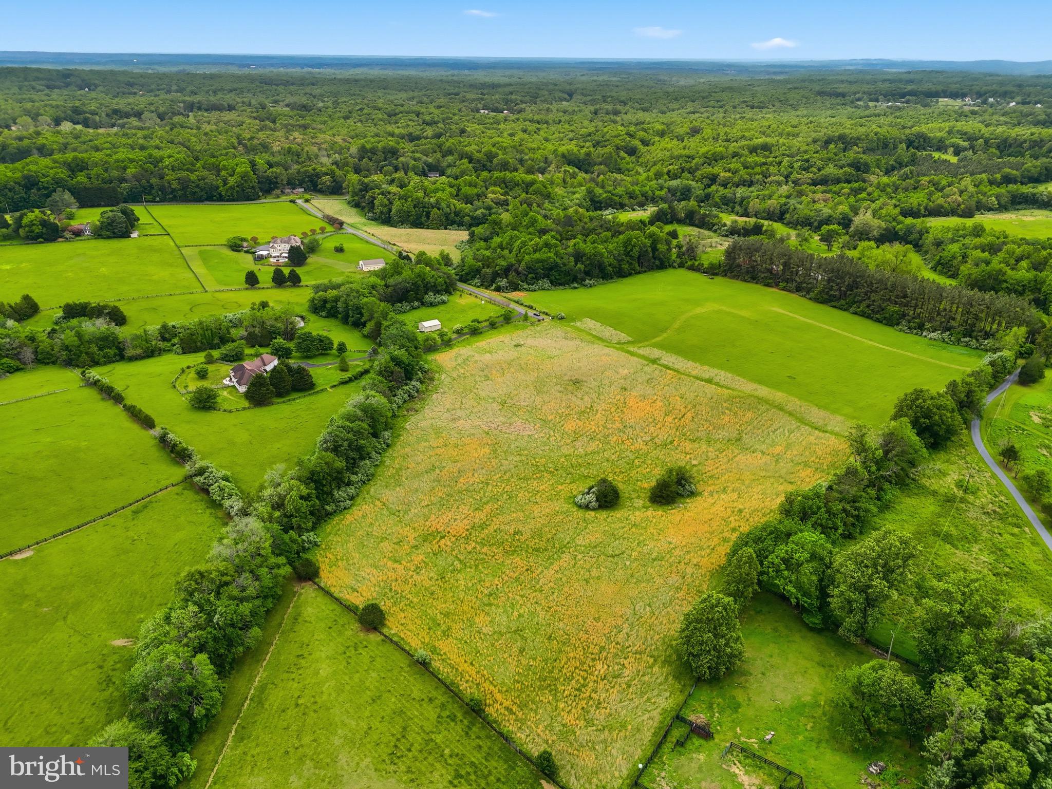 Discover a rare opportunity to own a pristine 10 acre homesite in scenic Rappahannock County, thoughtfully prepared and ready for construction. Enjoy breathtaking, unobstructed views from the cleared homesite, perfectly positioned to take advantage of the property’s natural beauty and peaceful surroundings. A convenient gravel driveway is already in place, helping streamline the path toward your future build.
Located within Windemeer Farm Estates, this exceptional property features expansive open pasture and a serene natural setting that creates the perfect backdrop for your custom dream home. Offering privacy, tranquility, and the beauty of Virginia countryside living, the property also provides convenient access to nearby towns, wineries, outdoor recreation, and commuter routes.
Whether you are ready to build with your own builder, interested in partnering with the current owner builder, or simply searching for the ideal homesite to hold for the future, this property offers exceptional flexibility and long term potential. The expansive acreage provides ample space for a custom estate home, outdoor living areas, recreational enjoyment, and more.
If you have been dreaming of building your own home, this property is also being offered as a to be built home opportunity. Please see MLS# VARP2002672 for additional details. You may choose from multiple available floor plans, each offering the opportunity for customization to fit your lifestyle, design preferences, and budget.