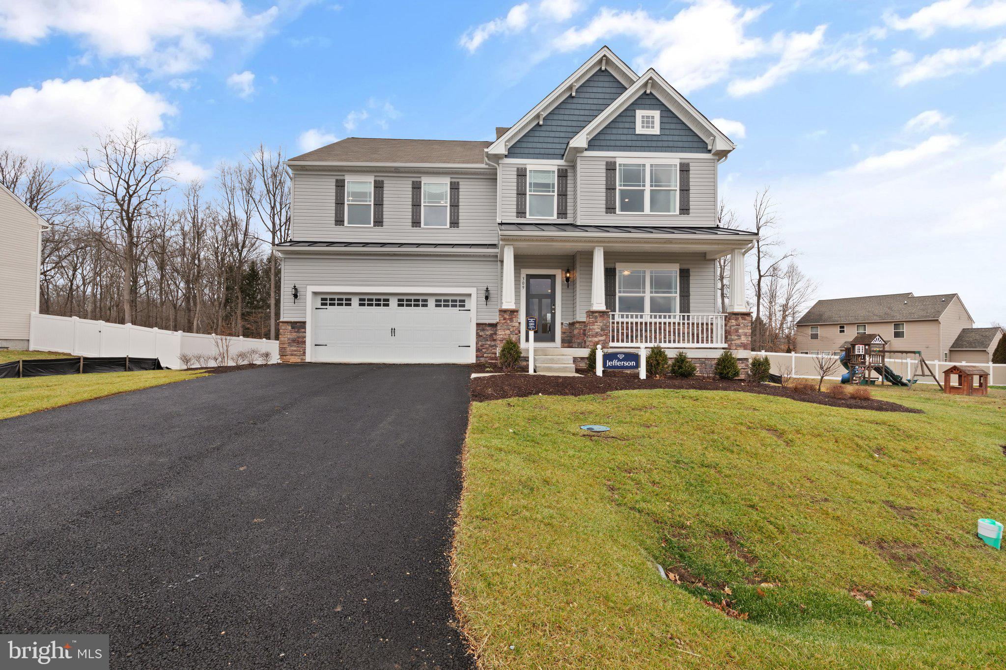 Quick Delivery Opportunity! Discover the popular Jefferson model by Gemcraft Homes, currently under construction and nearing completion in the highly sought-after Stoney Creek community in North East, Maryland.
This thoughtfully designed 4-bedroom, 2.5-bath home offers the perfect blend of style, functionality, and modern living. A welcoming front porch creates great curb appeal, while the spacious open-concept layout provides comfortable everyday living and effortless entertaining.
The kitchen is beautifully appointed with quartz countertops, an oversized center island with seating area, upgraded stainless steel appliances, maple cabinetry, and an undermount stainless steel sink. The kitchen flows seamlessly into the bright and inviting great room, highlighted by a stunning 60" SimpliFire electric fireplace that serves as the focal point of the main living area.
Additional upgrades include 9-foot ceilings on the main level, smooth ceilings throughout, upgraded flooring, recessed lighting, a hardwood foyer, ceiling fan rough-ins, and a 2-foot garage side extension spanning all three levels, providing additional space and flexibility throughout the home.
The spacious owner's suite offers a private retreat featuring a beautifully designed Venetian-style bath with a ceramic tile shower and glass enclosure, granite vanity tops, rectangular sink bowls, and comfort-height vanities. Additional windows throughout the home allow for an abundance of natural light.
The walkout basement with a 6-foot sliding glass door offers excellent storage, future finishing potential, and convenient access to the backyard.
Located in charming North East, residents enjoy easy access to waterfront dining, boutique shopping, local festivals, marinas, and nearby state parks offering hiking, fishing, boating, and outdoor recreation. Convenient access to I-95 and other major commuter routes makes commuting to Maryland, Delaware, and Pennsylvania simple and convenient.
Don't miss the opportunity to own a beautifully upgraded new construction home in one of Cecil County's most desirable communities. Contact us today for construction updates, estimated completion timeline, and available incentives.

Photos are for illustrative purposes only. Actual home, features, finishes, colors, and included options may vary.