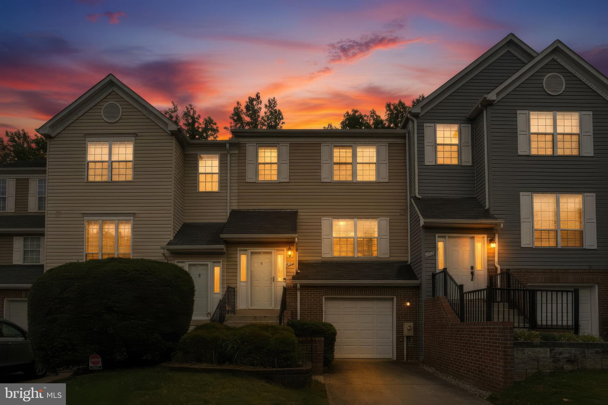 This beautifully maintained brick-accented townhome combines stylish updates with comfortable living spaces in a location close to everything you need. From the moment you enter, you’ll appreciate the gleaming hardwood floors, elegant crown molding, and welcoming ceramic tile foyer that set the tone throughout the home. The main level features a spacious and functional layout, highlighted by an updated eat-in kitchen complete with granite countertops, a center island with breakfast bar seating, stainless steel appliances, and easy access to the open dining area—perfect for both everyday living and entertaining.

Just beyond the dining room, the inviting living room showcases a marble-surround fireplace and dual sliding glass doors that lead to a brand-new elevated deck, ideal for outdoor dining or relaxing evenings. Upstairs, the spacious owner’s suite offers vaulted ceilings, a ceiling fan, walk-in closet, private bath, and a separate dressing vanity area for added convenience. The finished lower level expands the living space with a large recreation room featuring a walkout slider to the fenced backyard, along with a laundry room and half bath. Conveniently situated near shopping, restaurants, parks, entertainment, and major commuter routes, this home offers the perfect blend of comfort, style, and accessibility.