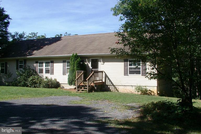 Awesome inviting & roomy ranch with very large rooms on 7 unrestricted acres. Large master bedroom suite on the main level with huge garden tub and master bathroom. Cathedral Ceilings. Large unfinished basement. Wonderful kitchen with new stove. dining room and a breakfast room. Splendid mountain views from the large, secluded deck! Did I mention 7 acres! Water treatment system.