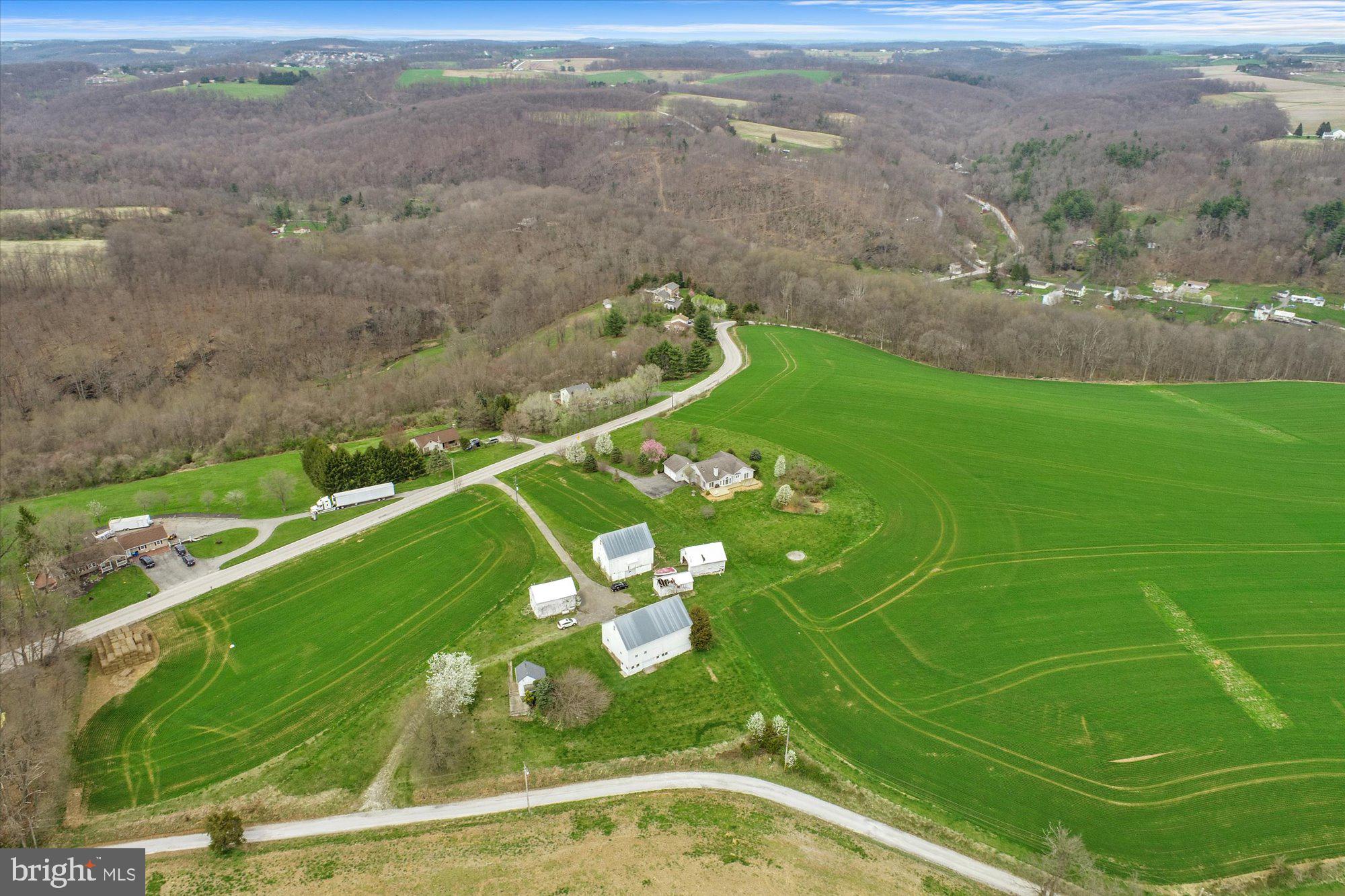 Opportunity is calling.....Seven separate properties being sold as ONE package-132 acre farm, home on acreage, plus five separately approved building lots (1+ acre each) and possible subdivision with two additional building rights.   The fresh air surrounding this picturesque 138.9 acre farm, with sweeping countryside views, is sure to please whatever you decide to do with it.  Whether you want to change your lifestyle; escape the suburbs; add to your farming portfolio; design and build a wedding venue; or build your own compound; this property is sure to have a remarkable effect on you and your dreams. The possibilities are great, including subdivision potential, with 5 approved building lots already in place and the possibility of two additional building rights (with East Hopewell Twp approval).  Original farmhouse was removed and a new 3BR, 2.5BA brick and vinyl rancher was built along Century Farms Rd. The home is comfortable and spacious, with a full lower level and oversized 2-car garage. The views, from the home and deck, are spectacular!  In addition, there are several outbuildings, including two bank barns, a corn crib, two storage/utility barns, and a summerhouse with a 2nd floor.  This rural refuge is a short commute to civilization and the Maryland/Pennsylvania Line.  Property is in Clean & Green and has a Land Preservation Easement on it.   AGENTS - VERY IMPORTANT TO READ AGENT REMARKS AND SEE BRIGHT DOCS.