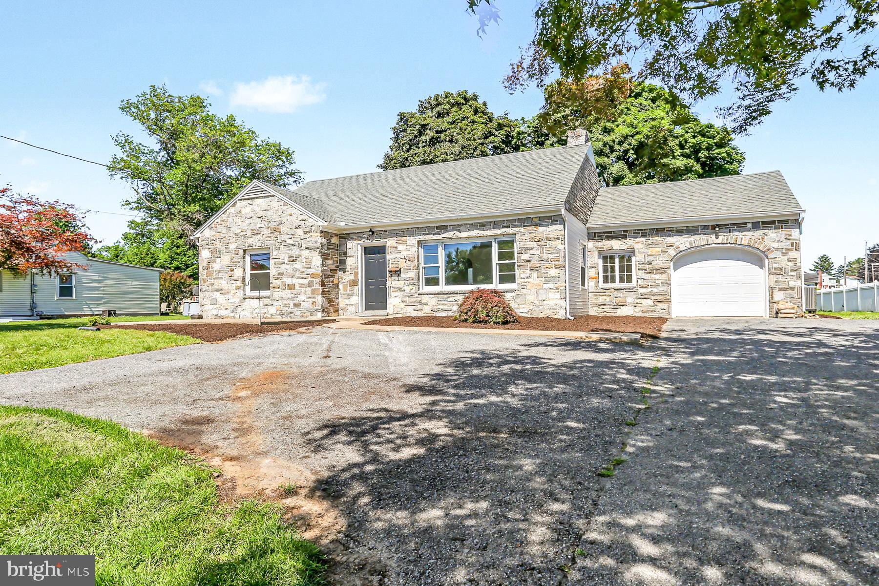 Stunning professionally remodeled 3 BR / 2 BA home perfectly located in Penn Manor Schools, just minutes from major routes and conveniences. This home features nearly 2,000 SF of above ground living space.... as you walk in the home you'll be greeted by the large living room, with new recessed lighting and designer LVP flooring throughout the living room, dining area and kitchen. The 37 handle kitchen is huge and features quartz countertops, unique subway backsplash and new stainless steel appliances. Perfect for entertaining, this kitchen has a convenient peninsula and large eat-in dining area with a large rear glass door leading to the patio outside. Enjoy 1st floor living with a large primary suite with brand new full bath! There's also an additional bedroom and full bath on the 1st floor as well as a 1st floor laundry area.  The 2nd floor has another bedroom that would be perfect for additional privacy, with a possible private entrance to the rear of the home.  The private backyard is nice and level and perfect for those summer evenings outside. Lots of $$ spent on this home including new siding/fascia/gutters, lots of new windows, central HVAC, water heater, new electrical & 200 amp service, lots of new plumbing as well as a new garage door! Come and see this one today!