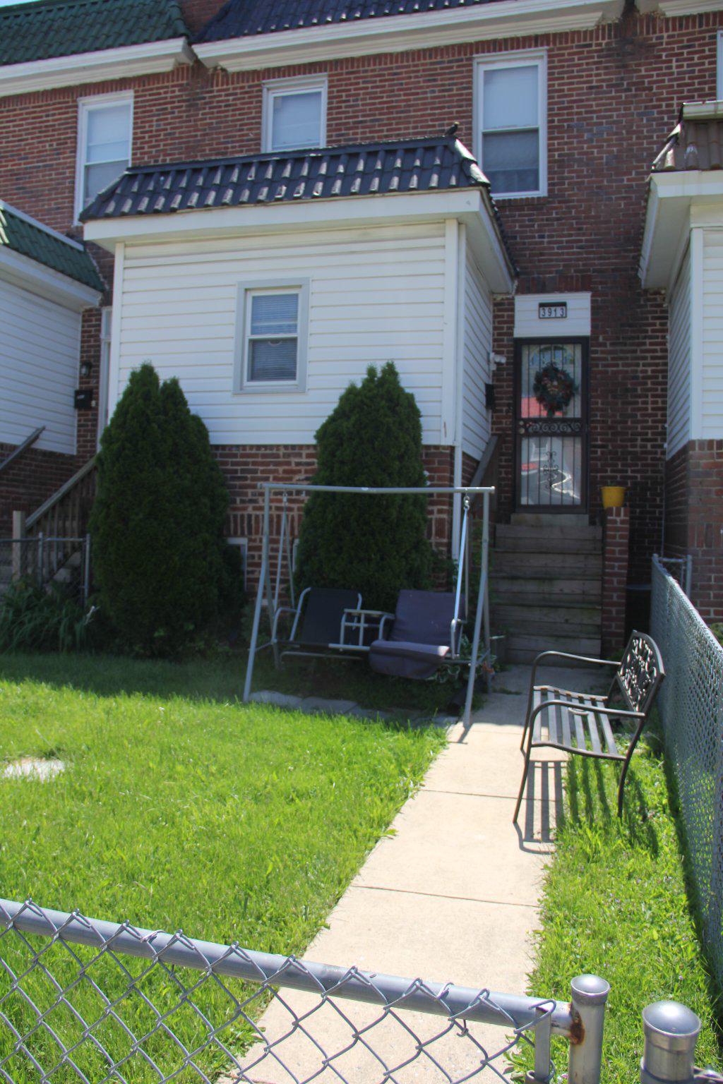 This charming 3-bedroom, 1-bathroom townhouse in the Garrison area offers a solid investment opportunity. The property features traditional brick and concrete construction, ensuring durability and low maintenance. The interior boasts a galley kitchen, seperate  dining  and living room areas, and a full basement, providing ample space for storage or potential rental conversion. Key appliances include a washer, dryer, refrigerator, and stove, enhancing tenant appeal. The property is in good condition, with carpet and ceramic tile flooring throughout. Outdoor features include a fenced front and rear yard, perfect for landscaping or outdoor activities. Located less than a mile from public transportation, this property is ideal for attracting renters seeking convenience. With no HOA fees and on-street parking, the potential for positive cash flow is significant. This townhouse presents a unique opportunity for investors or for first time buyers looking to invest sweat equity on a historic property in a desirable area.