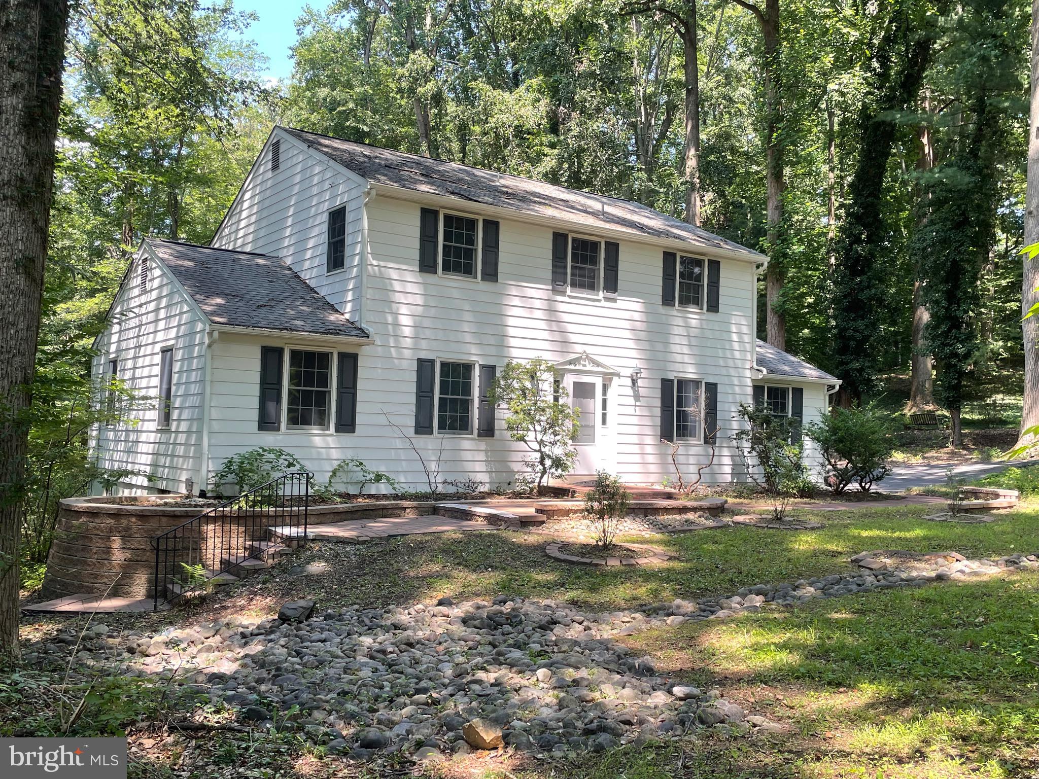 4 bedroom 2.5 bath home nestled on a wooded lot backing to a small creek in the center of desirable Covered Bridge Farms. Harwood floor throughout most of the house. Kitchen is dated but in good condition. Lots of wood cabinets. Updated appliances and a reverse osmosis system. Large den with fireplace ( newly lined 2025) and half bath. Primary bedroom has small walk-in closet plus second closet and a full bath with shower stall.  Full basement with separate entrance as well as interior access and huge picture window. 3 sump pumps, updated water system and HVAC. Home is wired for fiber. Large screened in porch off the back where you can relax and enjoy the wildlife.  New septic system 2026. Minutes from University of Delaware , Pennsylvania , Maryland and White Clay Creek Park. Property is being sold as is where is as part of a Trust .