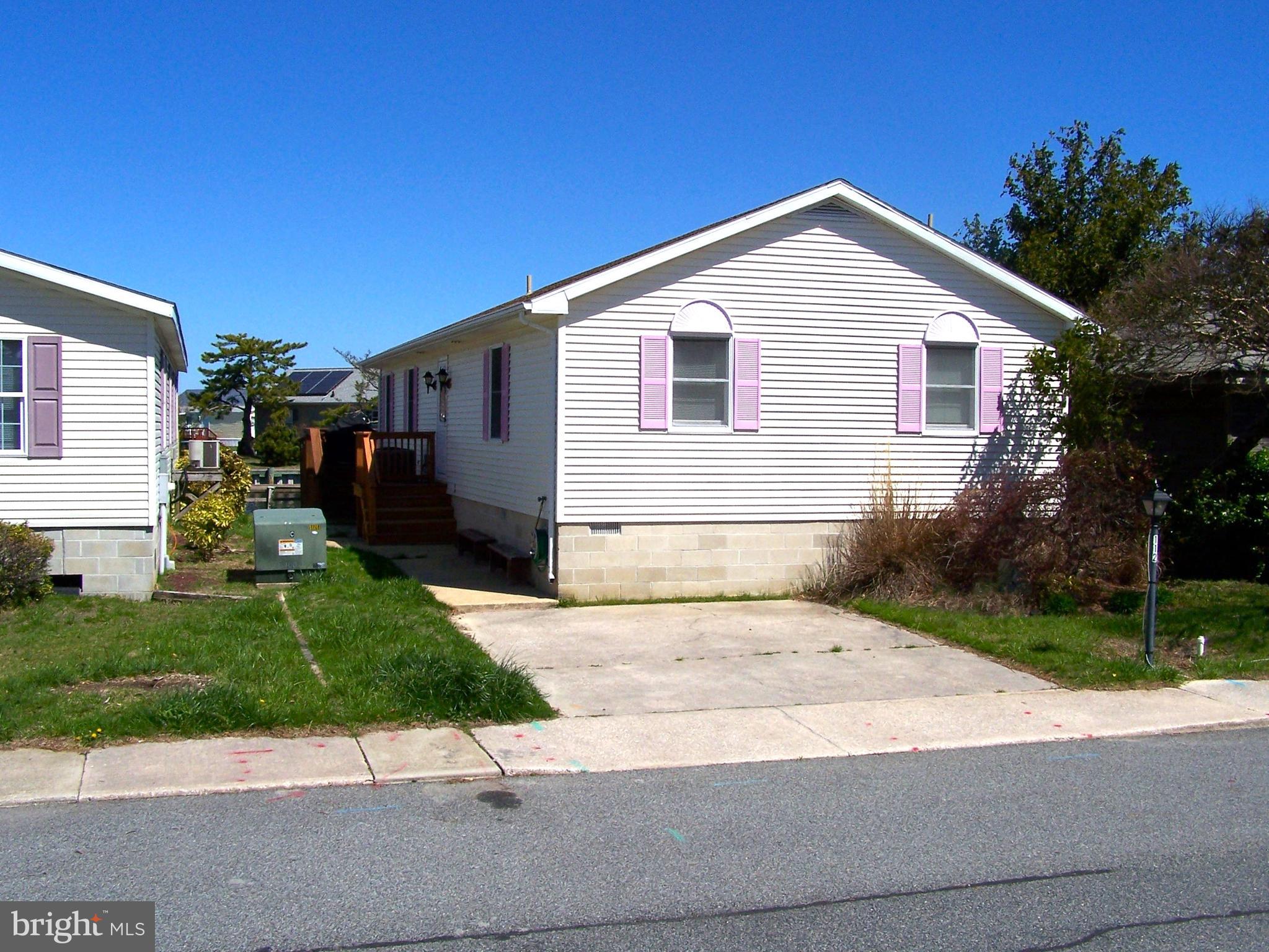 LOCATION, LOCATION, LOCATION!! Rare opportunity to own a waterfront home on one of the widest canals in Ocean City with only a 2-3 block walk to the beach! Also just a short walk to Ocean City's 58 Acre Northside Park, shopping, dining, the bus stop, and community amenities which include 2 inground swimming pools, 2 tennis courts, a 9 hole mini-golf course, a shuffleboard court, a pickle ball court, an 8- acre wildlife sanctuary/park area with large pond and a blacktop walking/jogging trail, and a bayfront boardwalk with 3 fishing/crabbing piers. This 3 Bedroom 2 1/2 bath home is move in ready and is being sold mostly furnished. Both full bathrooms have been updated with new ceramic showers. On the exterior this home features an outside deck, screened porch, a pier, a 7,000 lb remote control boatlift, a jet ski lift, and lots of storage. Call now to schedule your private showing.  Pontoon Boat conveys with property...1999 24ft. Sweetwater w/ Honda 90 hp motor. Low HOA fee of $415.00/year!!