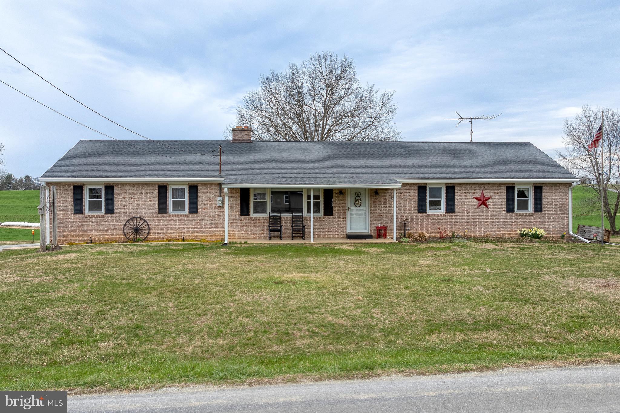 Recently renovated 3 bed, 2 bath brick rancher with nearly 1,400 sqft on almost an acre surrounded by scenic farmland views. This home is perfect for those looking to get away from the hustle & bustle and enjoy the best of Lancaster's countryside. The spacious living room features a wood burning fireplace and large front windows providing natural light. Newer LVP flooring runs throughout the main living space. The updated kitchen features stainless appliances, granite countertop, and a peninsula with seating area. Both bathrooms are updated, including a large main bath with tub shower.  Enjoy entertaining on the rear concrete porch overlooking the large rear yard and farmland. Other highlights include newer architectural shingle roof, 2-car attached garage, driveway with extra parking area, and a full basement. Schedule your private showing before it's too late!