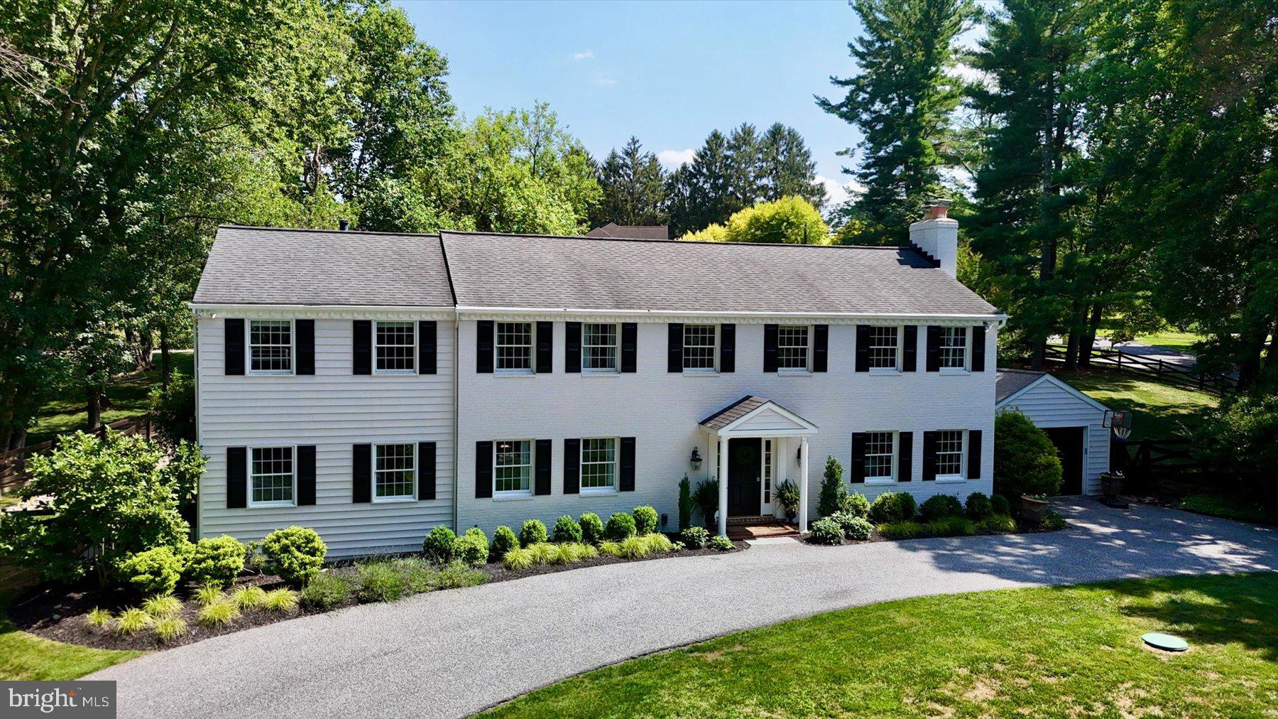 PRICE ADJUSTMENT  on this wonderful brick colonial perched on the hill.  Located in the Falls Rd Corridor on a  1.09-acre lot, this home embodies effortless everyday living.  Surrounded by mature trees, the property offers privacy, expansive outdoor spaces, and the appeal of one of Baltimore County's most desirable locations. The traditional floor plan  is thoughtfully designed for both gracious entertaining and comfortable living. Hardwood floors extend throughout the first and second floor, complimented by  built-ins, detailed crown molding, recessed lighting,  and 3 fireplaces.   The main level features a welcoming entrance hall, private study, formal living and dining rooms, a spacious family room, and a well-appointed kitchen with an adjoining breakfast room, laundry room with cubbies for the kids and powder room.   A screened porch and flagstone patio invite indoor-outdoor living, providing the perfect setting for morning coffee, evening gatherings, or simply enjoying the  perennial garden.  The second floor features 5  bedrooms and 3 baths. 
The finished lower-level recreation room provides exceptional flexible space for games, fitness, media, or play and an abundance of storage. 
The expansive, fully fenced rear yard provides ample room for a trampoline, lacrosse /soccer nets and  playground equipment.   Additional features include a  generator, central air, and  one-car garage
Offering classic architecture, meticulous care, and a setting that is both peaceful and convenient, this is a rare opportunity to own a distinguished property in one of the region's most sought-after neighborhoods.