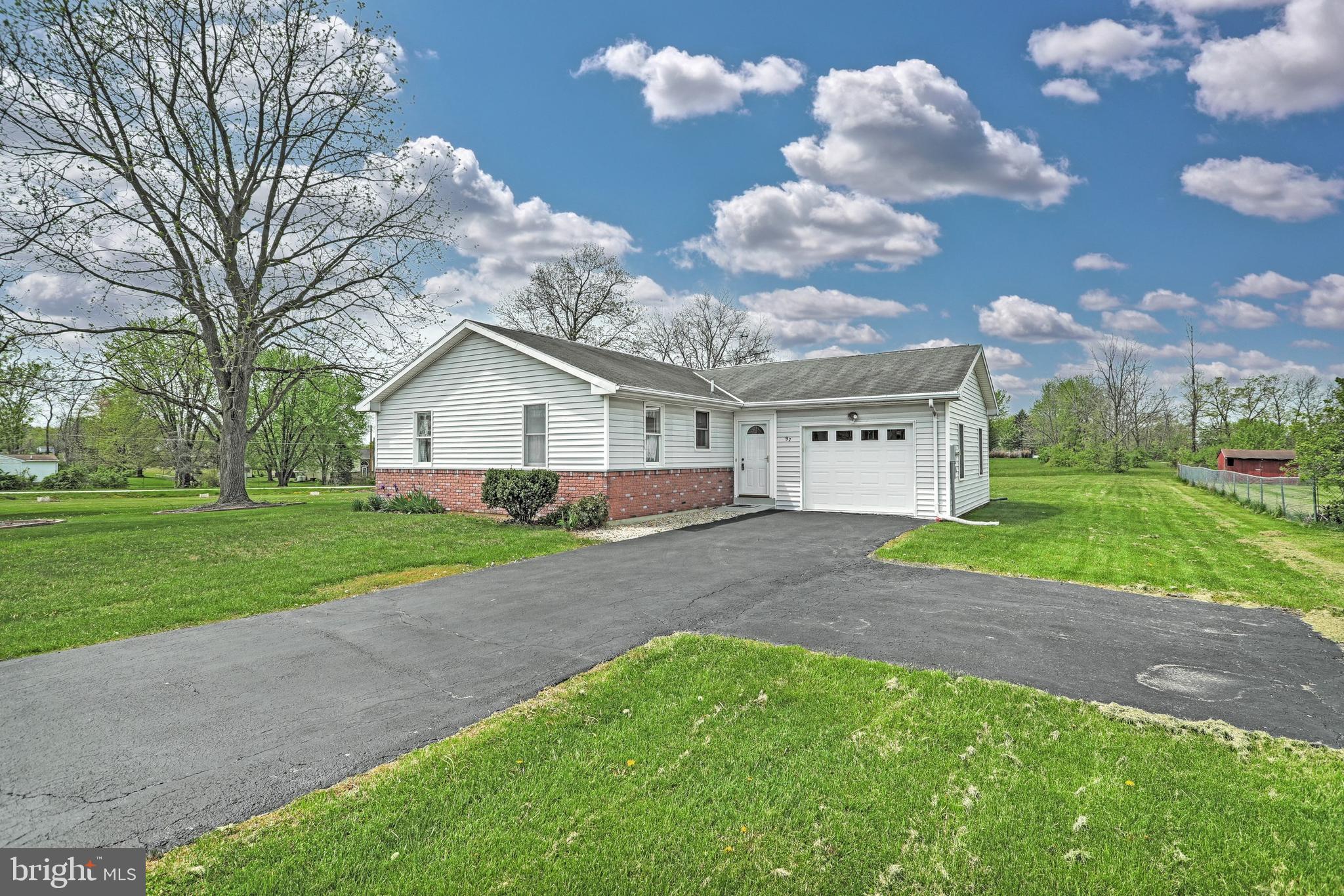 This affordable, adorable ranch style home offers a level yard adjacent to open space. Bright and cheery with an open floor plan, large kitchen including appliances, first floor laundry room  and 1.5 baths. There is laminate flooring throughout. The garage is oversized with an auto garage door opener. Great opportunity to build some sweat equity.  This home is being sold as is. Seller will not make any repairs. Come enjoy the Lifestyle of Lake living at Lake Meade, a private gated community. Our Lake is manmade consisting of approximately 300 acres & 5.84 miles of shoreline. Water sports are a blast on the lake, including water-skiing, tubing, wake boarding, paddle boarding, kayaking & swimming. Power boats, kayaks, canoes, sailboats and pontoon boats share the Lake. (Some restrictions do apply) Anglers will love fishing here. Bass, Walleye, Perch, Crappie, Blue Gills, Sunfish are just some of the fish you will have fun reeling in. Activities for all ages include a swimming pool with lifeguards & a giant slide with two curves, zero entry with a mushroom fountain with depth to 3 feet. The Diving Area is 12 feet deep with two diving boards. Main rectangular pool is 50 x 82 with depths of 4 to 5 feet deep. There is also a bath house with showers, lockers & a snack shack. Lake Meade has 10 water front access with boat docks, playground equipment and picnic areas. There are 2 basketball courts, a tennis court where you can play pickle ball too. The sports complex offers a baseball field, sand volley ball courts, soccer fields, playground equipment for small children & a picnic pavilion. The marina features Macs pizzeria an informal eatery with outdoor deck and summer fun. There are two boat launches & limited boat services available. Our 4th of July celebration is a culminated spectacular over the water firework display. Lake Meade Municipality provides us our public water and sewer. Northeast Adams Fire and EMS serves East Berlin and our community with one station inside the Lake. When visiting our community you must have a Realtor with you to take a tour or look at a home.