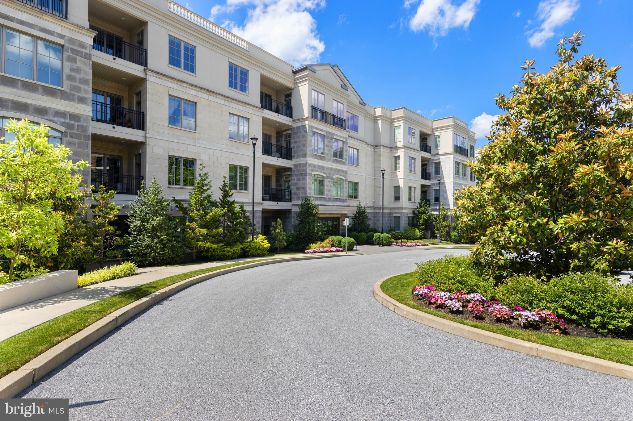 Location! Location! Location! A condo in the luxury residential building at 100 St. Georges Road in Ardmore rarely becomes available. “Downsizing” has never easier in this stunning 2-bedroom, 3-full bathroom, very spacious, penthouse unit. The elegant 4-story condo building is just steps away from Suburban Square; a short walk to downtown Ardmore for additional shops and restaurants, and to the AMTRAK and SEPTA station which provides direct service to Philadelphia and NYC. 

Light permeates this tastefully upgraded and professionally decorated penthouse unit on the fourth floor. Immaculately maintained, the chef’s kitchen stands out with state-of the art appliances, oversized quartz island and custom backsplash which opens to the living and dining areas as well as the large balcony. The living room has a gracious gas fireplace providing so much ambiance as well as handsome, custom built-ins. The primary bedroom has two, large walk-in closets and sumptuous spa bath as well as a second balcony.  The second bedroom is graciously appointed and has an ensuite bathroom.  There is a den which could be used as a third bedroom with a full bathroom right across from this space.

Two deeded parking spaces are in the secure, well-lit, underground garage the building as well as a large storage room. There is a fully equipped gym room on the first floor as well as a card room area and kitchenette.