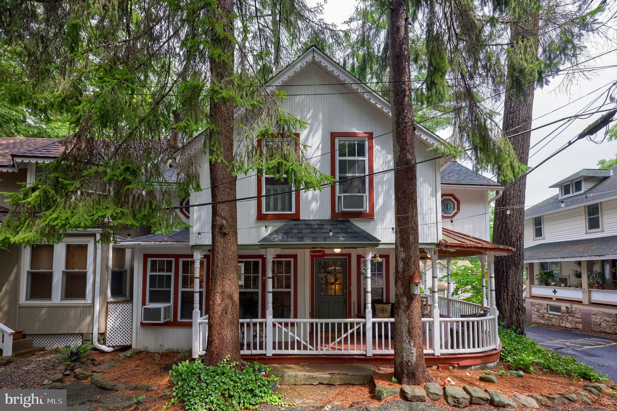 Welcome Home! Small but mighty, this meticulously cared-for Mt. Gretna cottage perfectly blends character with thoughtful updates. Ideally located in the heart of Mt. Gretna, you'll be just a short stroll from all of the community's beloved seasonal activities.
This low-maintenance treasure showcases an updated custom kitchen with newer appliances, beautiful hardwood flooring, and charming French doors that open onto the inviting wrap-around porch. The upgraded bath features a custom tiled walk-in shower, while the loft provides flexible space for, a home office, or a cozy reading nook. The unfinished basement, recently improved with a vapor barrier and dehumidifier system, offers excellent storage. A convenient first-floor laundry area is tucked just off the kitchen, and a newer propane furnace provides added comfort and peace of mind. Whether you're searching for a full-time residence or the perfect weekend getaway, this move-in-ready cottage has everything you need—including all appliances. Don't miss this opportunity to own a beautifully updated Mt. Gretna gem where character, charm, and convenient location come together to create the perfect cottage lifestyle.
Shown by appointment, Parking located in stone lot