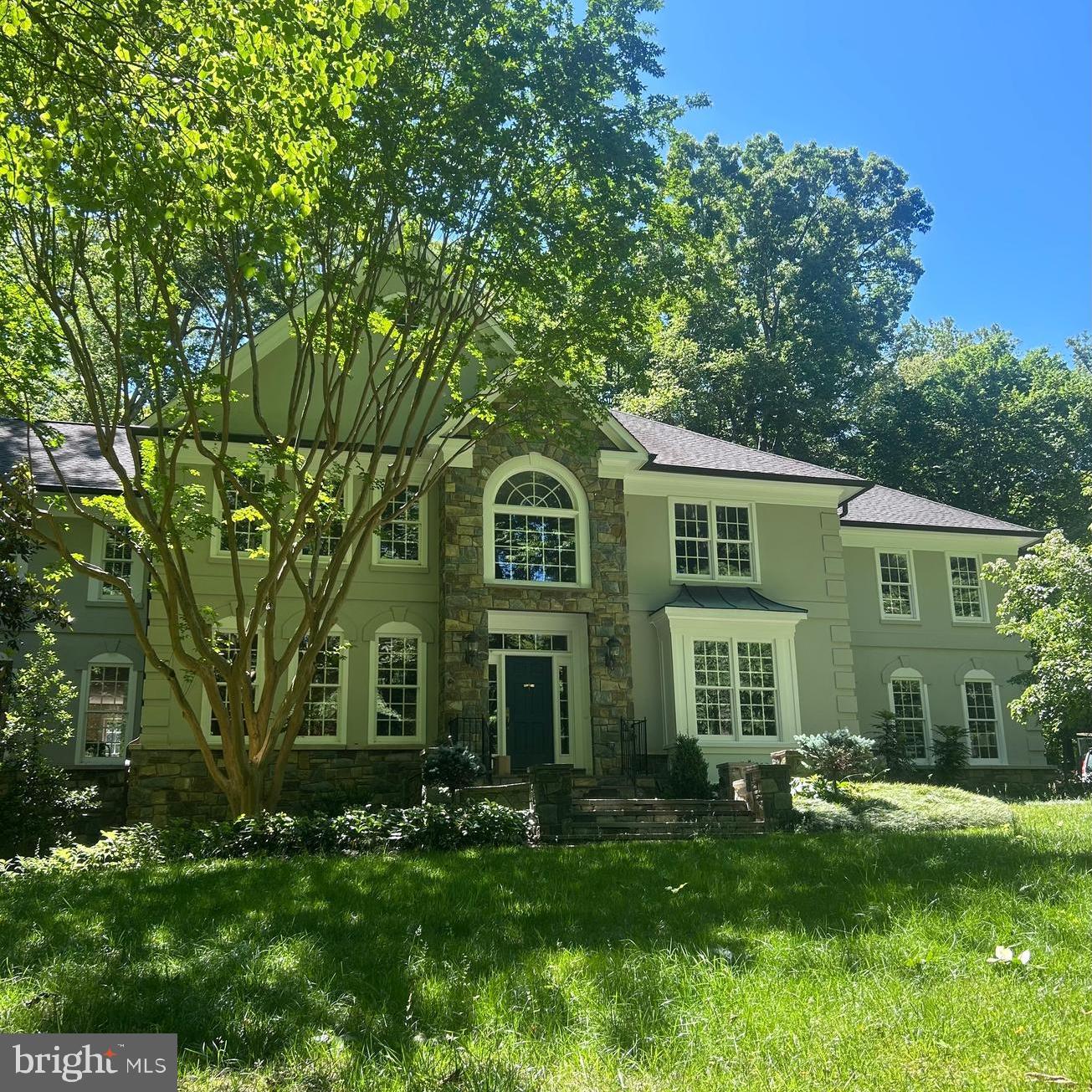 Welcome to 7211 Twelve Oaks Drive, located in the private Twelve Oaks neighborhood in Fairfax Station. This Renaissance Custom Homes colonial is perched on five spectacular scenic acres offering privacy, tranquility and room to roam. The home features a beautiful mix of recent updates and incredible craftsmanship, making it a home for a lifetime. Step inside the grand foyer and discover an open floorplan designed for both everyday living and entertaining. The formal dining room which can easily seat a large crowd for holidays and grand dinner parties has a custom painted ceiling and designer wallpaper. The elegant living room is light filled and leads into the huge solarium. The formal library includes cherry cabinetry, faux tin ceiling, faux leather walls, and a gas fireplace with marble surround. The two-story family room boasts a floor-to-ceiling dry-stack stone fireplace, heart pine floors, arched Palladian windows, double ceiling fans, and sliding doors that open to the huge deck with built in planter box and retractable awning. The expansive center island kitchen is a chef's dream including a 6-burner Viking gas range with griddle plus an additional Viking wall oven and warming drawer, Sub-Zero fridge, wine fridge, granite counters, and California Closets pantry system. The sunny breakfast nook overlooks woodland views.  A marble powder room, coat closet, and butler’s pantry with wine storage and custom cabinetry offer functionality and charming character.

Upstairs, the versatile layout includes four bedrooms and a loft. The primary suite features a private sitting room/office, hardwood entry, freshly painted primary bath with Jacuzzi tub, walk-in shower, dual vanities, two large walk-in closets, and ceiling fan. The secondary suite has double-height ceilings, extensive windows, walk-in closet, and private bath with double vanity, walk-in shower, tub, and linen storage. A third en-suite guest room includes its own bath, ceiling fan, and wooded views. Additional highlights include dual staircases, chandelier-lit upper hallway, custom display niches, and scenic views from every room.  

Downstairs you'll enjoy additional entertaining spaces including the art deco theater room with its platform seating and surround sound which make the perfect gathering space for movie nights at home.  

The professionally landscaped property is a true retreat featuring a multi-level deck with curved railings, firepit seating, retractable awning, flagstone patios/paths, stone pillars, and custom arbor accents. Enjoy resort-style outdoor living with a 20’x40’ flagstone-surrounded pool, custom stone hot tub, and a fully equipped post-and-beam pool house featuring a vaulted ceiling pavilion with woodland carvings, a seasonal full bath, and dedicated equipment room. A separate wood-burning outdoor fireplace with grill shelf and a charming garden shed complete the setting.

Perfectly located between the Fairfax County and Prince William Parkways, this Fairfax Station estate is just minutes from Burke Centre, historic Old Town Clifton, Burke Lake Park, Fountainhead Regional Park, Ft. Belvoir and much more. Homes rarely come on the market in this very special enclave.