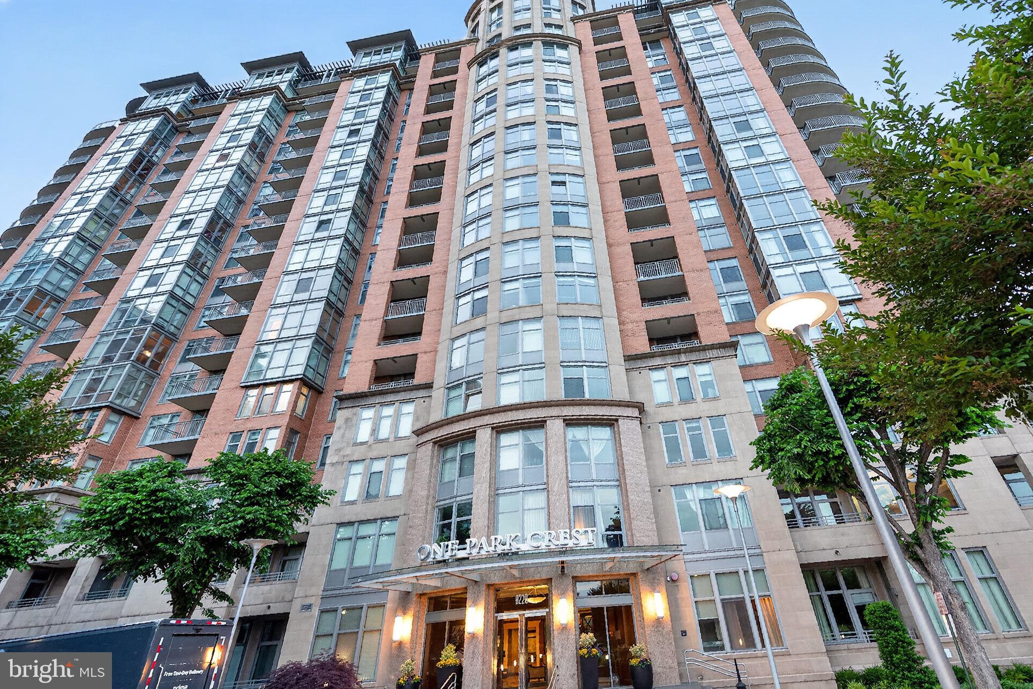 LUXURY TYSONS CONDO over 1200+ sqft | CLOSED DEN WITH A DOOR offering flexible space for a home office, guest room, or additional living area. | 2 FULL BATHS | MCLEAN HIGH SCHOOL PYRAMID With 2 Assigned Parking Spots 
THE LAYOUT ADVANTAGE: DUAL FULL BATHS & HOME OFFICE SUITE


Experience unmatched scale, premium high-rise serenity, and design flexibility in this expansive 1,215 SQFT luxury condo—representing one of the largest one-bedroom floor plans available in the entire Tysons and McLean market. Perched high on the 14th floor of prestigious One Park Crest, this rare layout is a masterclass in spatial efficiency, offering the square footage of a traditional two-bedroom unit at a highly optimized price point.


THE LAYOUT ADVANTAGE: DUAL FULL BATHS & HOME OFFICE SUITE


True Home Office Wing: Unlike standard open-concept dens that spill into your living space, this unit features a structurally distinct, private executive office wing. It is an independent architectural alcove perfectly framed and ready for custom glass sliders or modern French doors—allowing a remote professional to easily establish complete acoustic privacy without sacrificing natural light.

Two Full Bathrooms: A rare luxury asset for a one-bedroom floor plan, providing ultimate convenience for owners and guests alike.


14th Floor South-Facing Views: A wall of glass and a private balcony flood the entire home with brilliant southern sunlight while offering tranquil courtyard and tree-lined vistas.


Gourmet Chef's Kitchen: Equipped with gas cooking, premium stainless steel appliances, a granite center island, and rich hardwood flooring that flows seamlessly into the expansive main living area.


THE LOCATION MATRIX: WALK TO TYSONS METRO & CORPORATE HQs


Nestled in the ultra-convenient, highly walkable urban epicenter of Tysons (Walk Score: 7.0/10), this residence offers immediate proximity to everything that drives Northern Virginia value:


Transit & Shopping: Short walk to the Silver Line Metro and world-class retail/dining at Tysons Galleria and Tysons Corner Center.


Employment Centers: Minutes from the national corporate headquarters of Capital One, Booz Allen Hamilton, Hilton, and major tech hubs.


Elite Schools: Located within the highly coveted, top-rated Fairfax County Public Schools pyramid: Spring Hill Elementary, Longfellow Middle, and McLean High School.


Commuter Arteries: Instant access to I-495 (Capital Beltway), Rt 123, Rt 7, and the Dulles Access Road.


ALL-INCLUSIVE VALUE: THE MATH OF ONE PARK CREST LIVING


Your monthly condo fee delivers a predictable, cost-efficient financial framework by covering almost all operational utility costs: Gas, Water, Sewer, Trash, 24-Hour Security, and Resort-Style Amenities.

Rooftop Pool & Sky Lounge: Panoramic, sweeping vistas of the Northern Virginia skyline.

Premium Health Club: Fully equipped fitness center and on-site community spaces.

White-Glove Service: 24-hour concierge, secure elevator access, an elegant library, assigned secure underground garage parking (1 space conveys), and private on-site guest suites available for visiting family.

Security & Staff: Covers 24-hour security, security gate, management, and reserve funds.  
Recreation: Includes access to the pool, health club/fitness center, and community center.  
Beyond your door, indulge in world-class amenities: a rooftop pool with panoramic vistas, a fitness center, 24-hour concierge, and a library.                                                                                                                                                                Nestled in the heart of Tysons with immediate access to premier dining and the McLean High School pyramid, this is more than a home—it is your private overlook above the city.
All Photos AI Staging